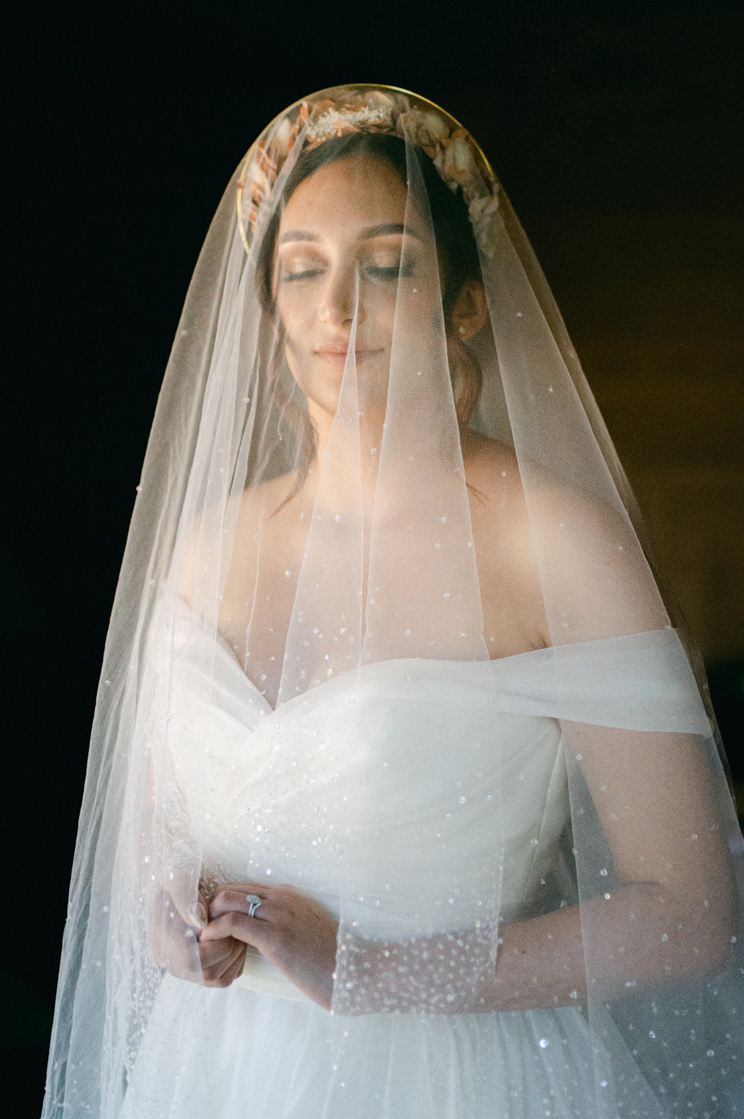 Nakoma Resort Wedding photography, photo of bride wearing her cathedral veil over her face
