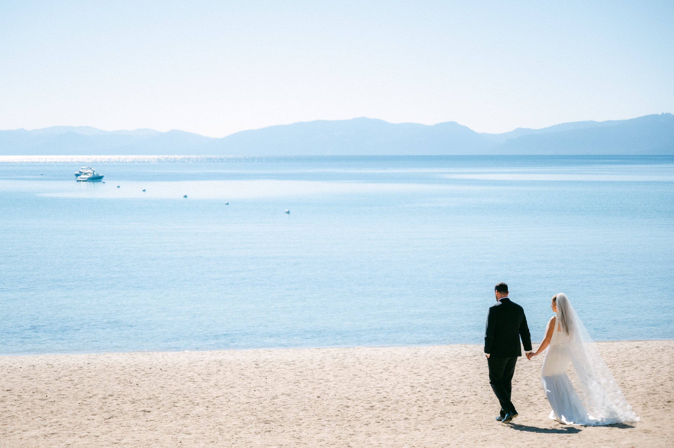 Hyatt Lake Tahoe wedding, photo of couple walking by lake tahoe