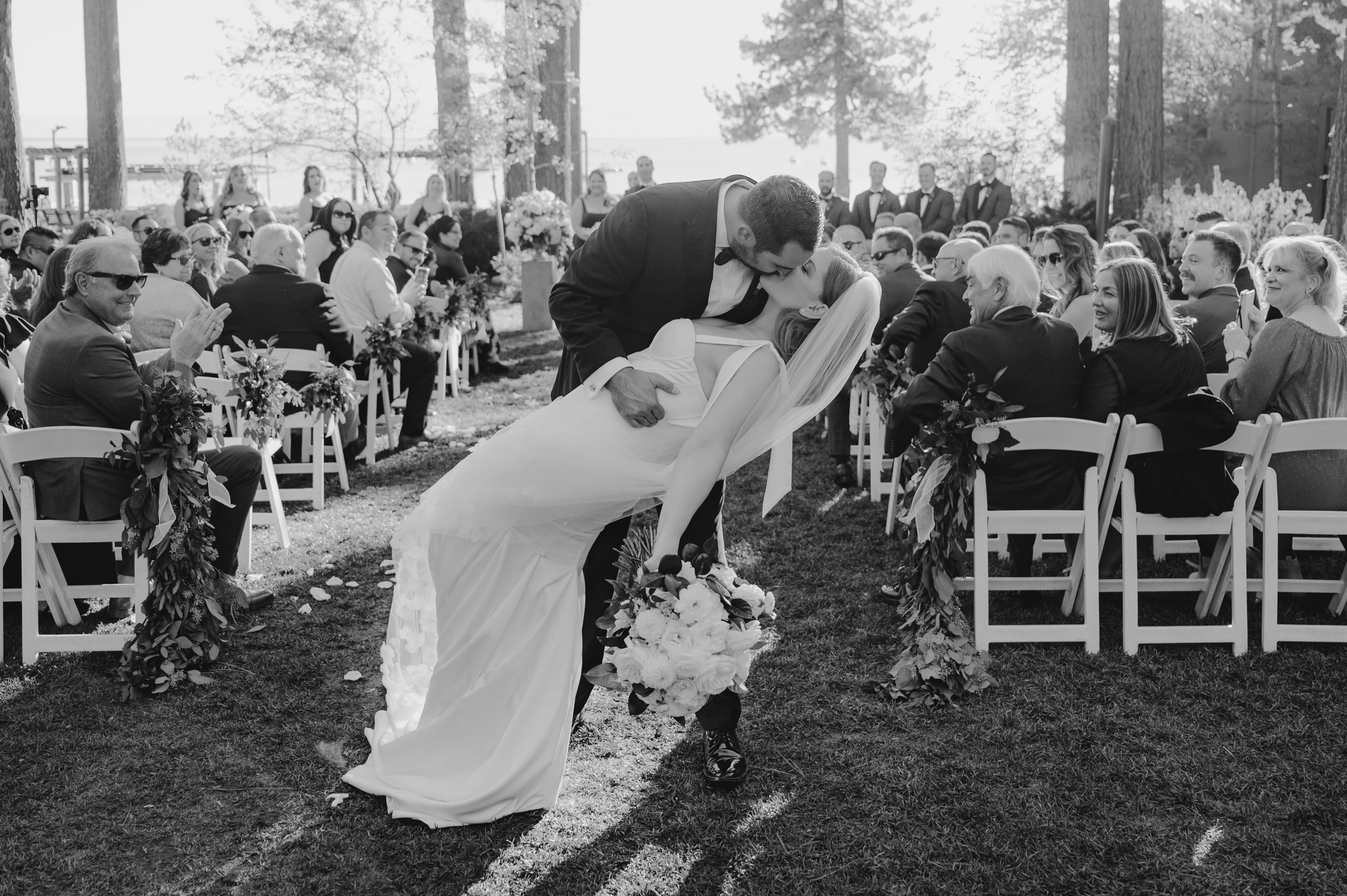 Hyatt Lake Tahoe wedding, photo of couple kissing at the end of the aisle 