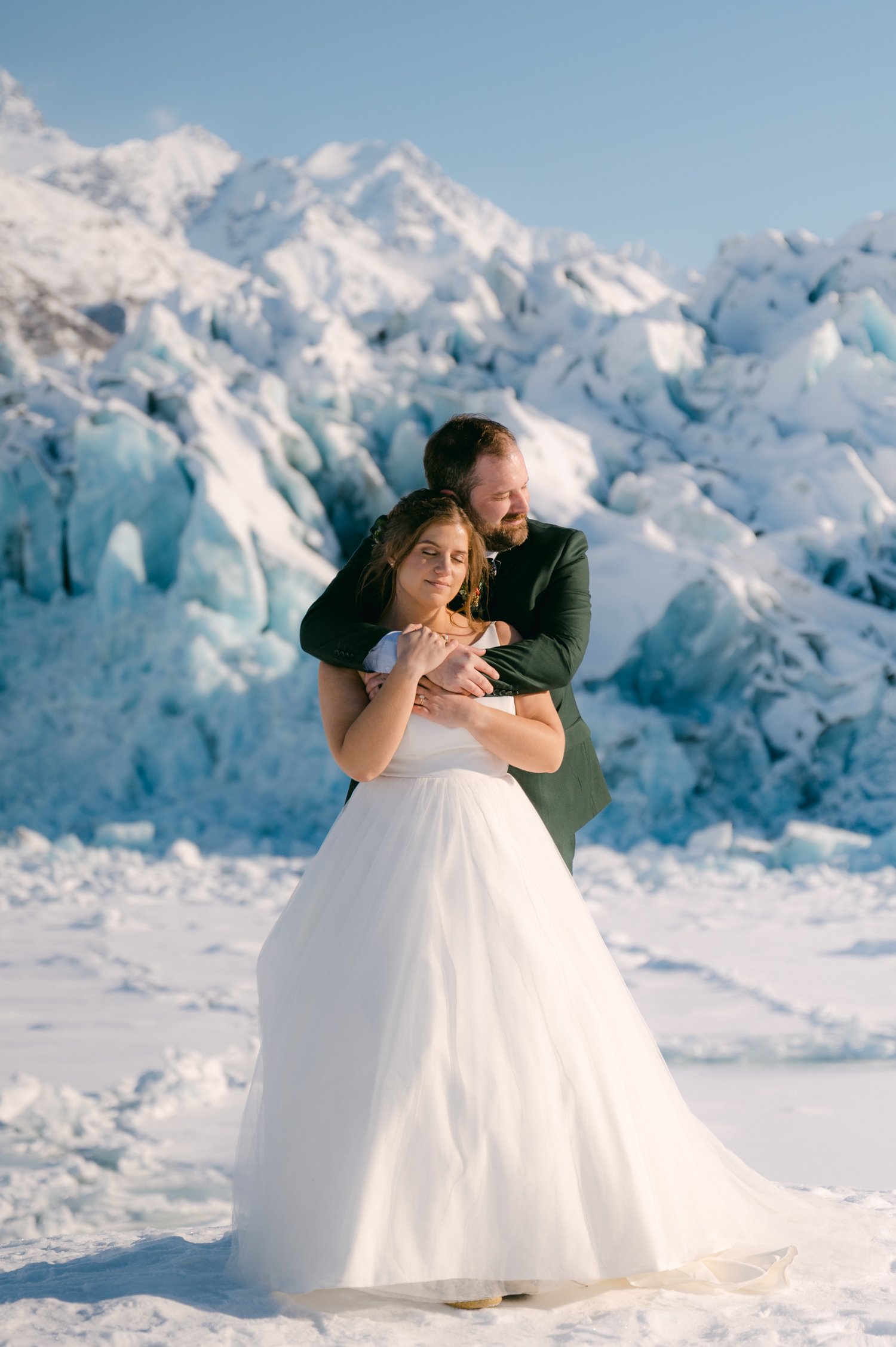 Girdwood Alaska helicopter elopement, photo of couple in front of a glacier