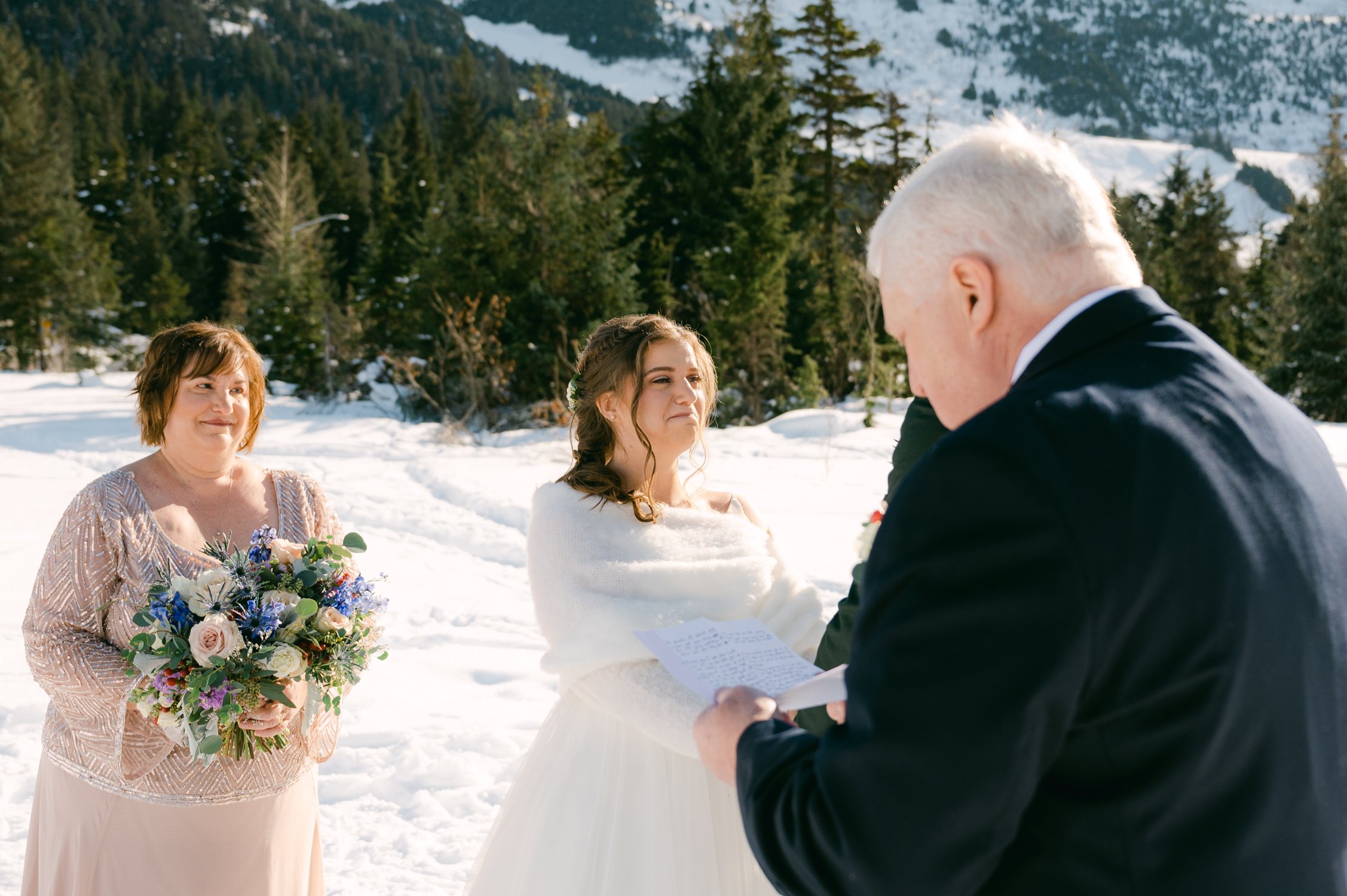 Girdwood Alaska helicopter elopement, photo of couple having their ceremony at moose meadows