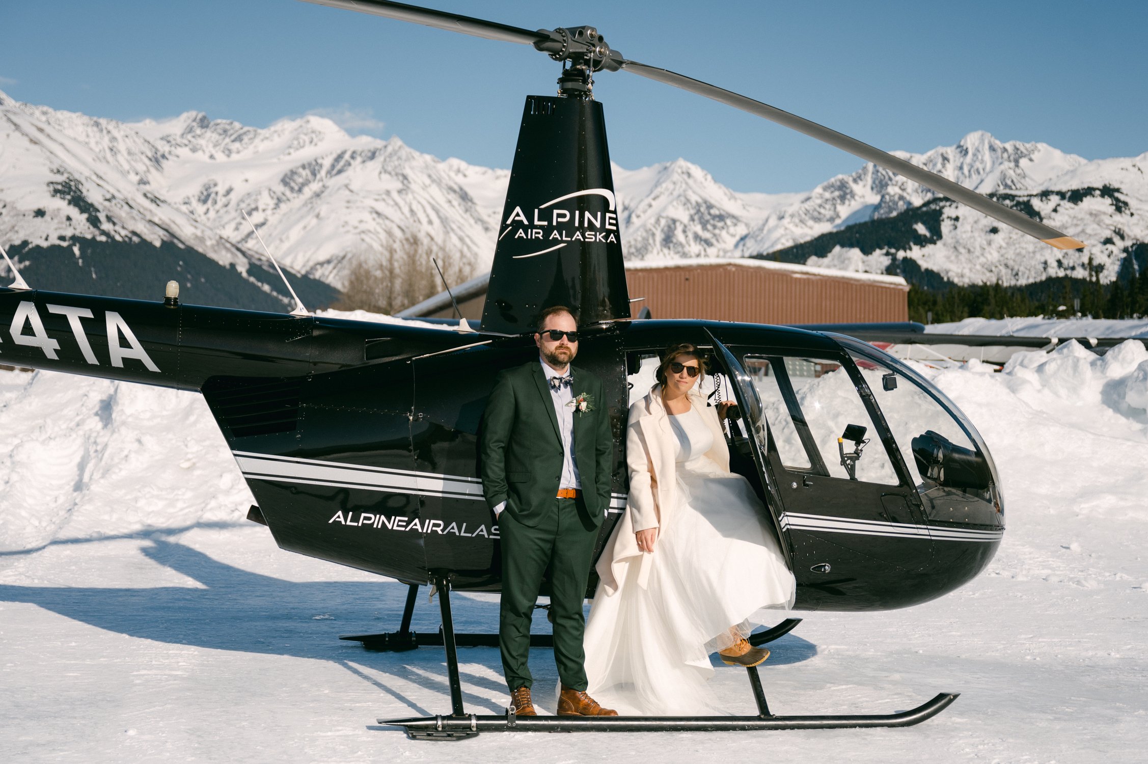 Girdwood Alaska helicopter elopement, photo of couple having their photoshoot at a glacier