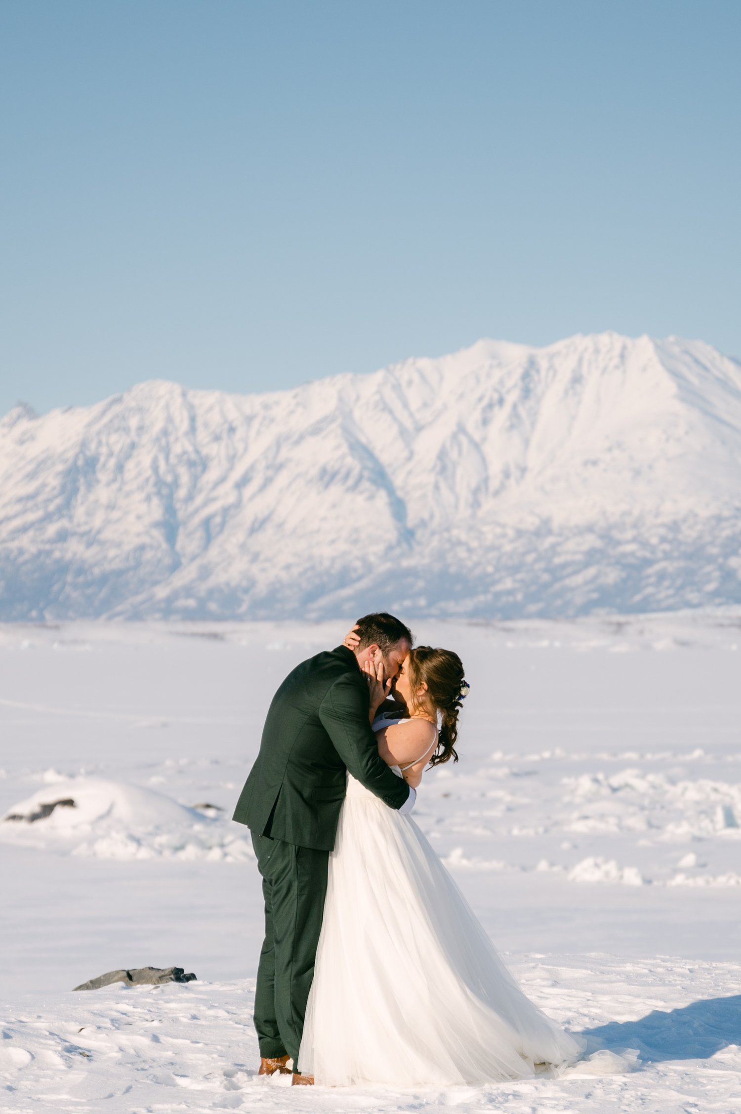 Girdwood Alaska helicopter elopement, photo of the couple kissing
