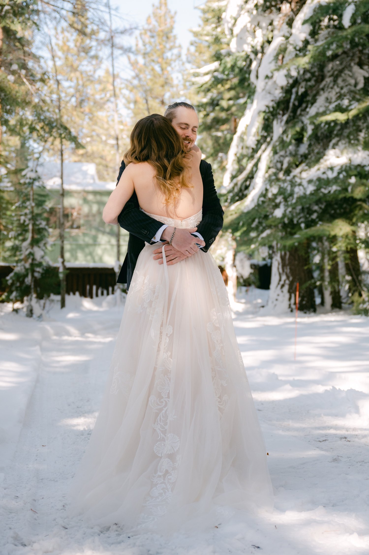 An elopement during a historic winter in tahoe, photo of couple having their first look