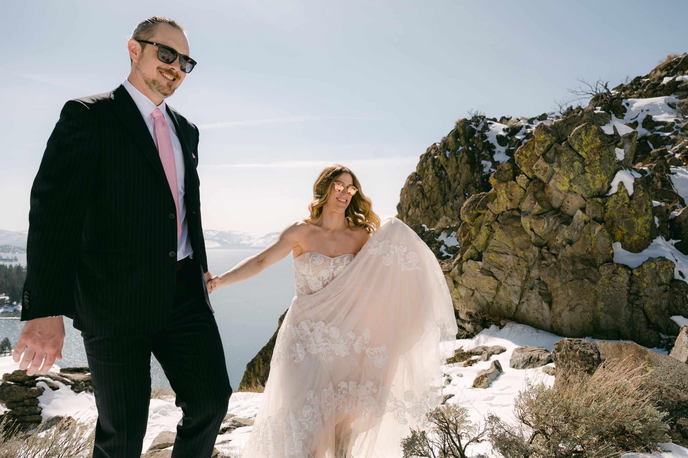 winter tahoe elopement, photo of couple snowshoeing on their wedding day