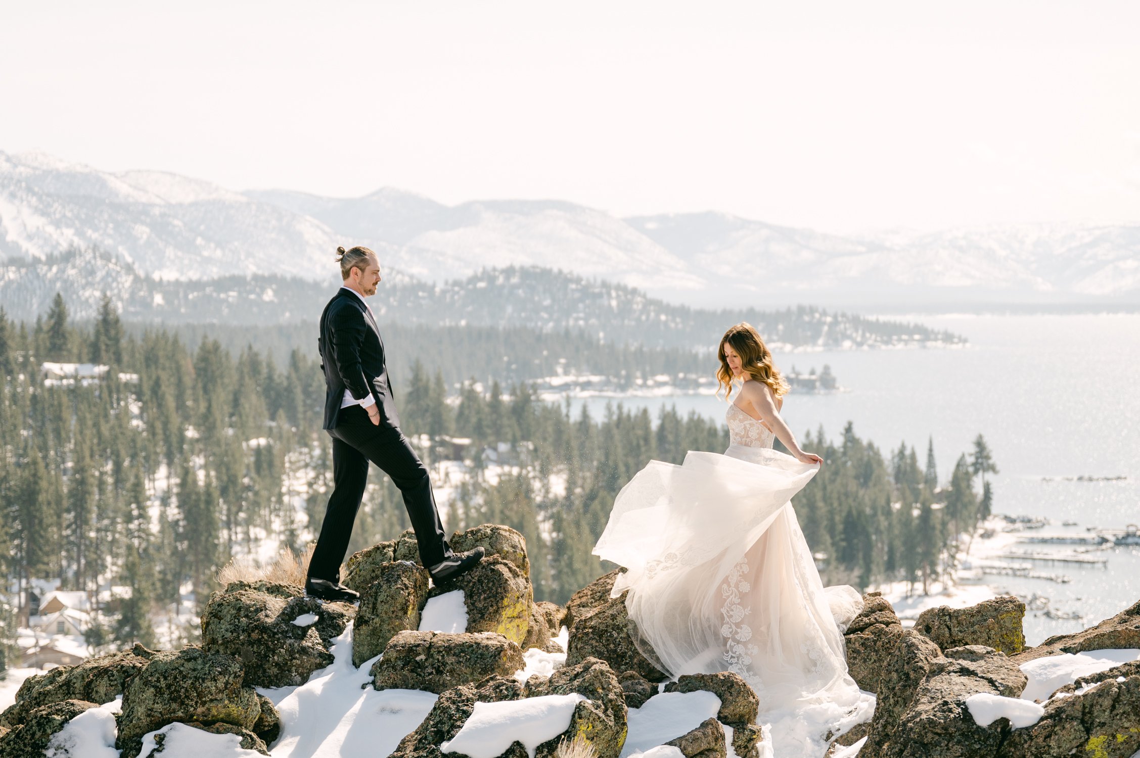 winter tahoe elopement, photo of couple on top of a hill
