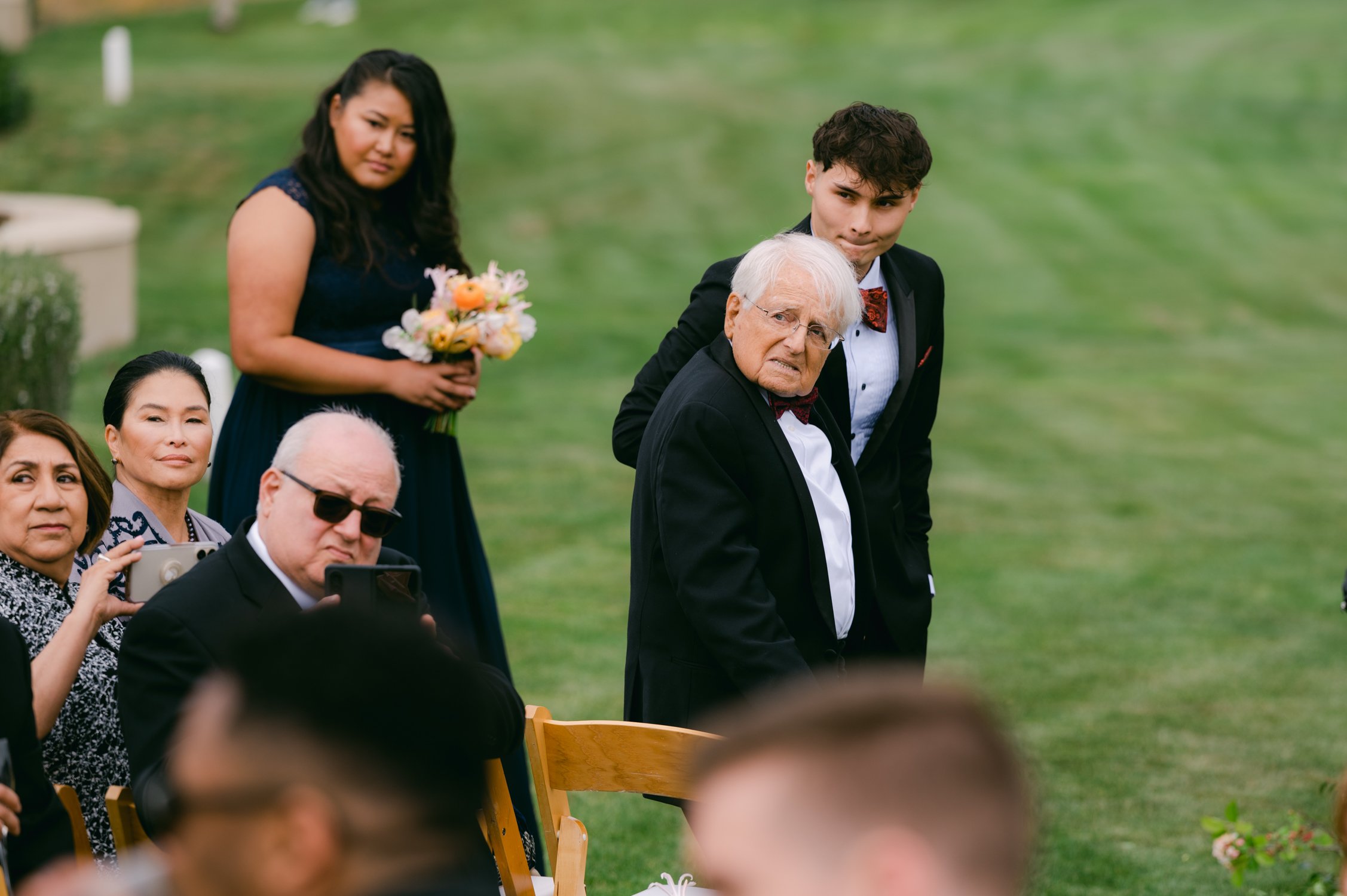 pebble beach resort wedding photo of dad looking back at his daughter walking down the aisle