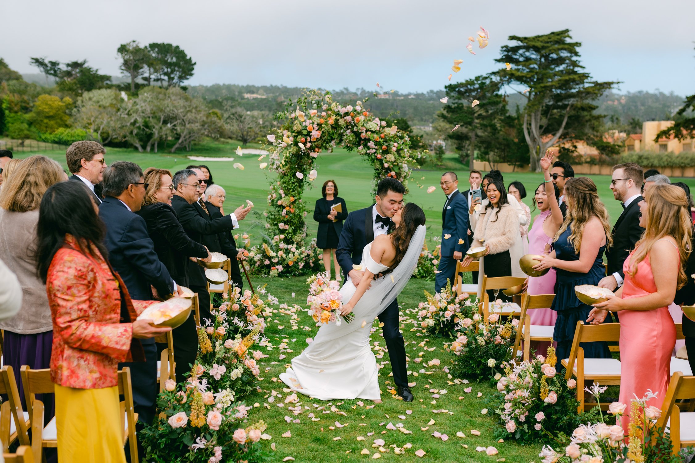 pebble beach resort wedding photo of couple during their ceremony exit