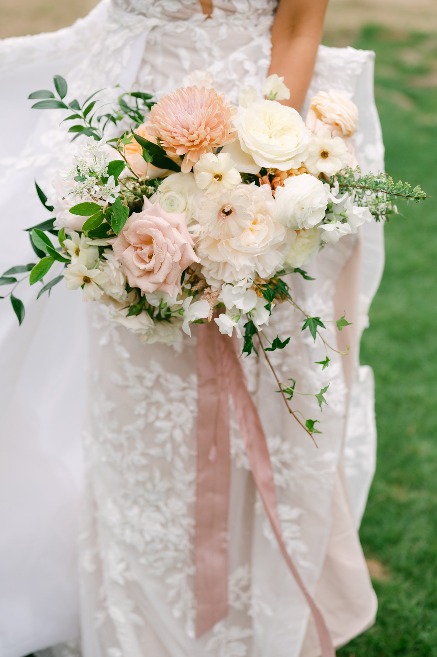 Everyone Resort &amp; Spa Wedding Venue, photo of bride and her spring florals