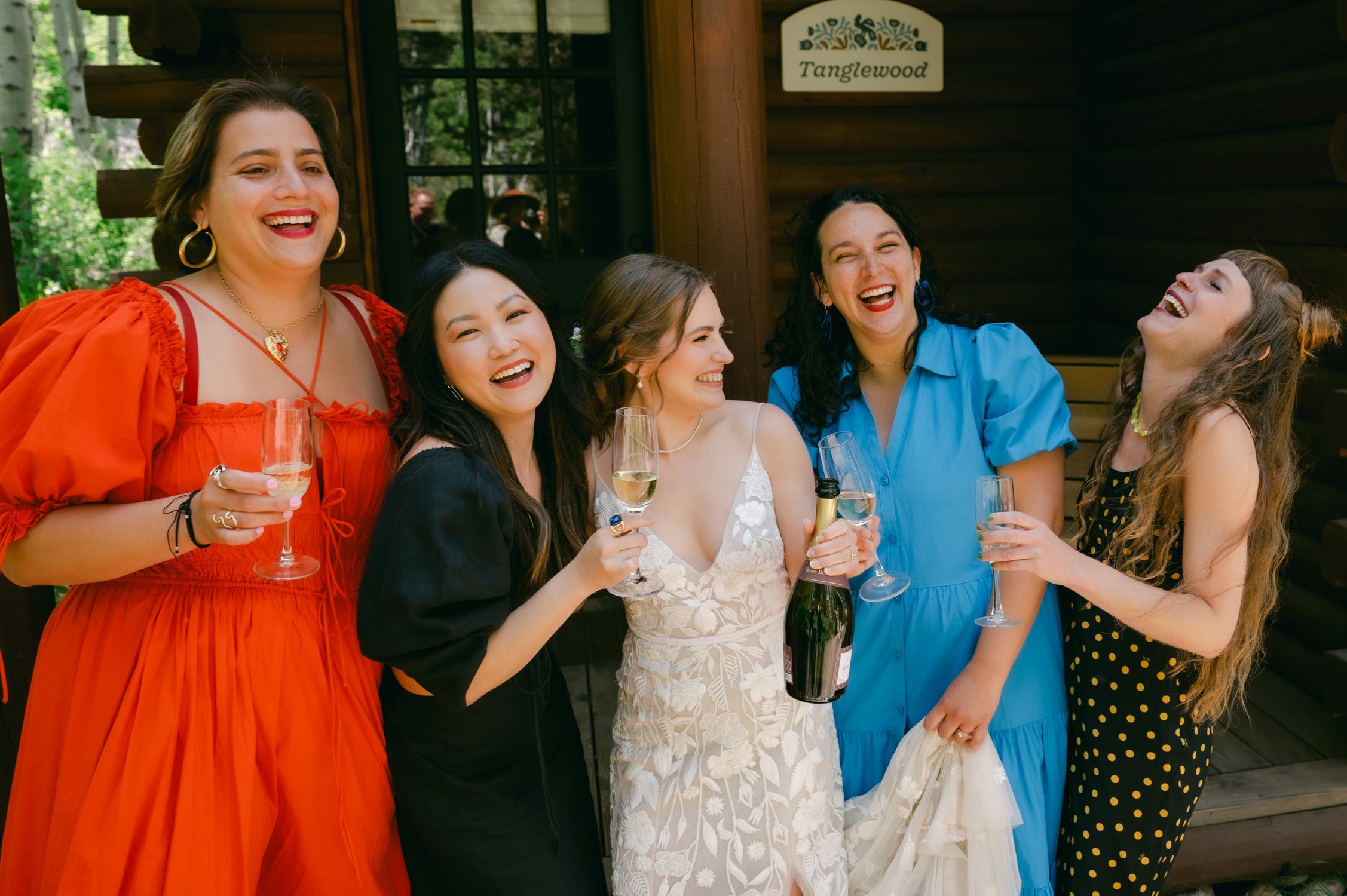 Desolation wilderness hotel wedding, photo of bride and bridesmaids having a champagne toast