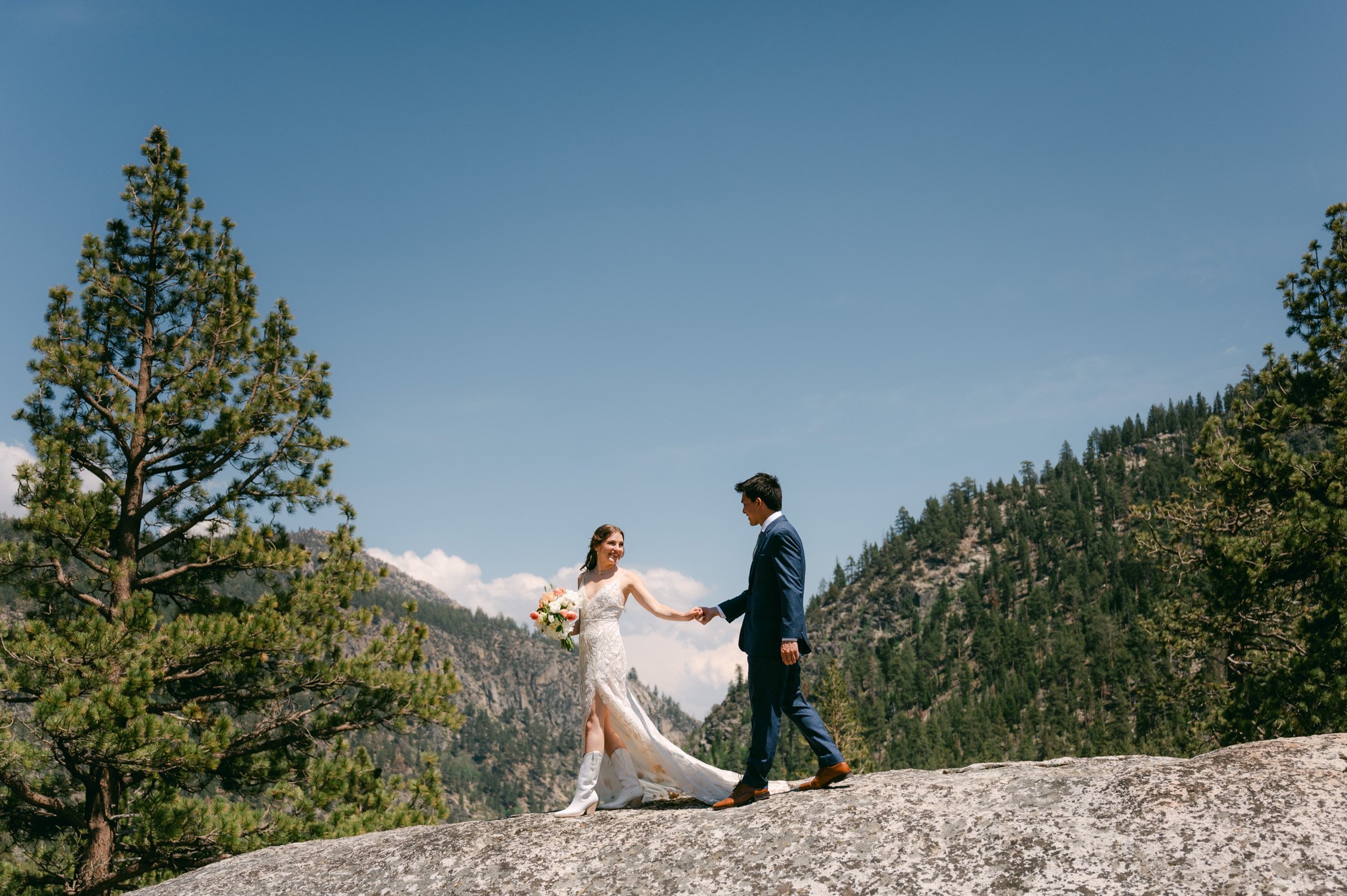 Desolation wilderness hotel wedding, photo of couple on a mountain holding hands