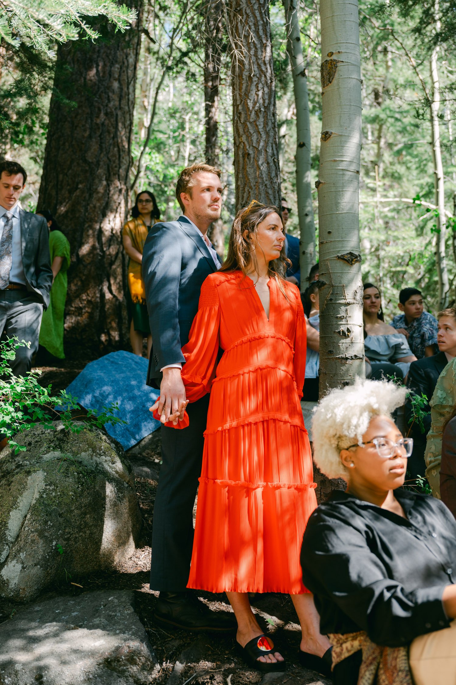 Desolation wilderness hotel wedding, photo of guests holding hands during the ceremony