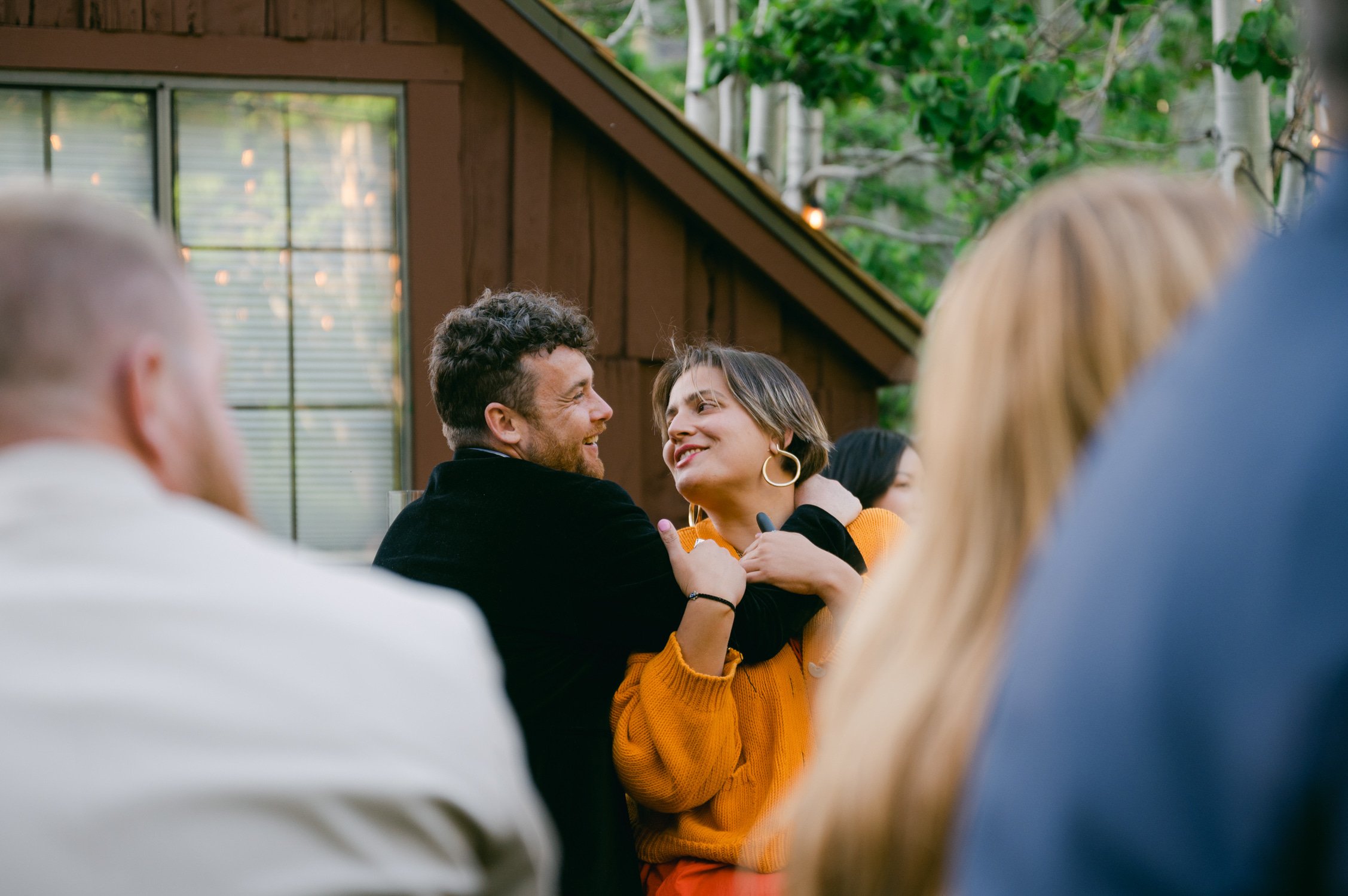 Desolation wilderness hotel wedding, photo of guests cuddling during the toasts