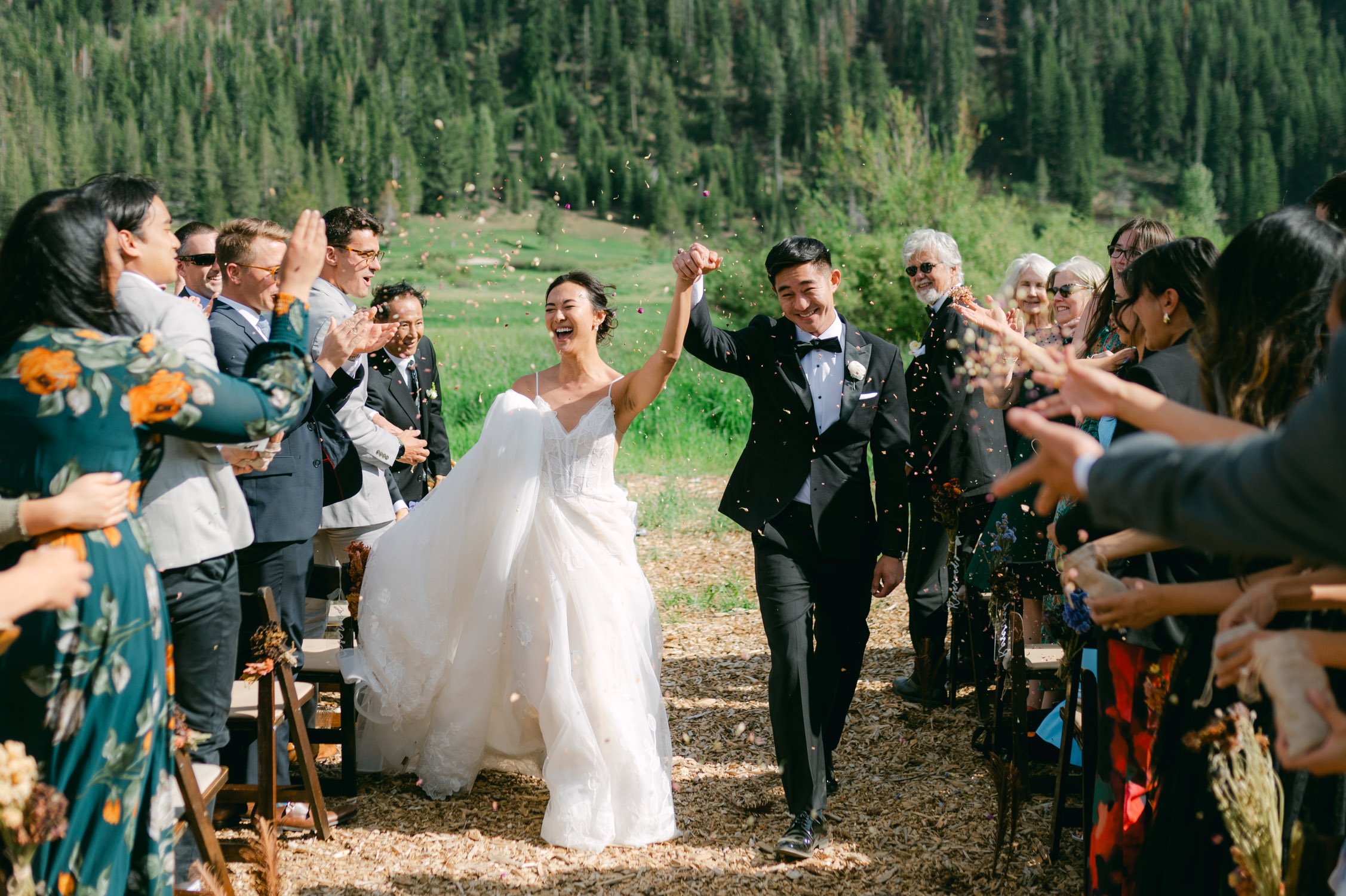 olympic valley stables wedding, photo of a newly wed couple during the confetti shower after their wedding ceremony