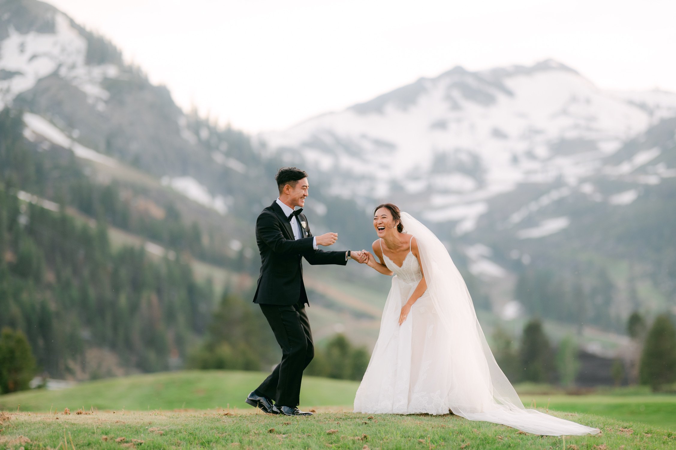 olympic valley stables wedding, photo of a happy newly wed couple during their portrait session with a mountain in the background