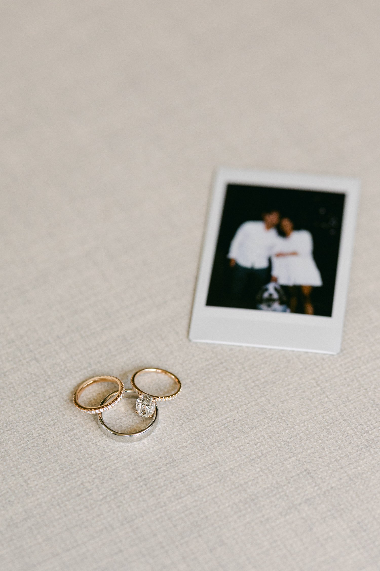 olympic valley stables wedding, photo of wedding rings and a polaroid photo of the couple