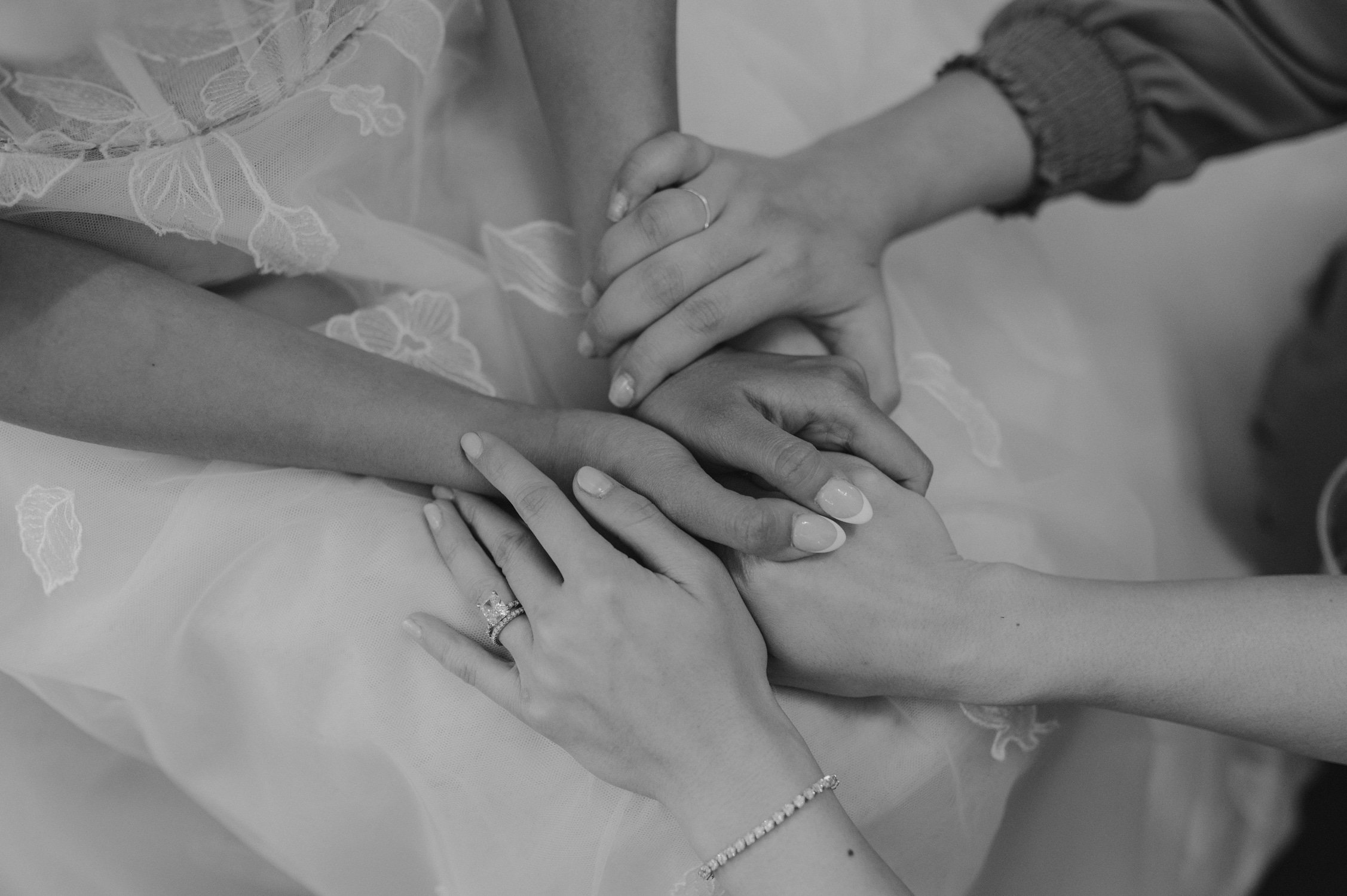 olympic valley stables wedding, photo of the bride and bridesmaids holding hands