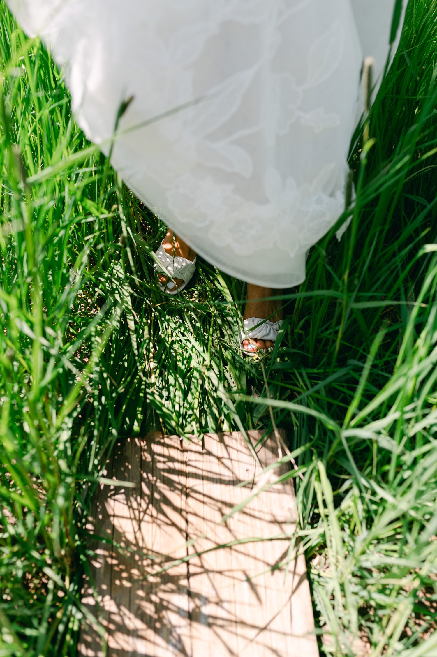 olympic valley stables wedding, photo of the bride's shoes walking on the grass