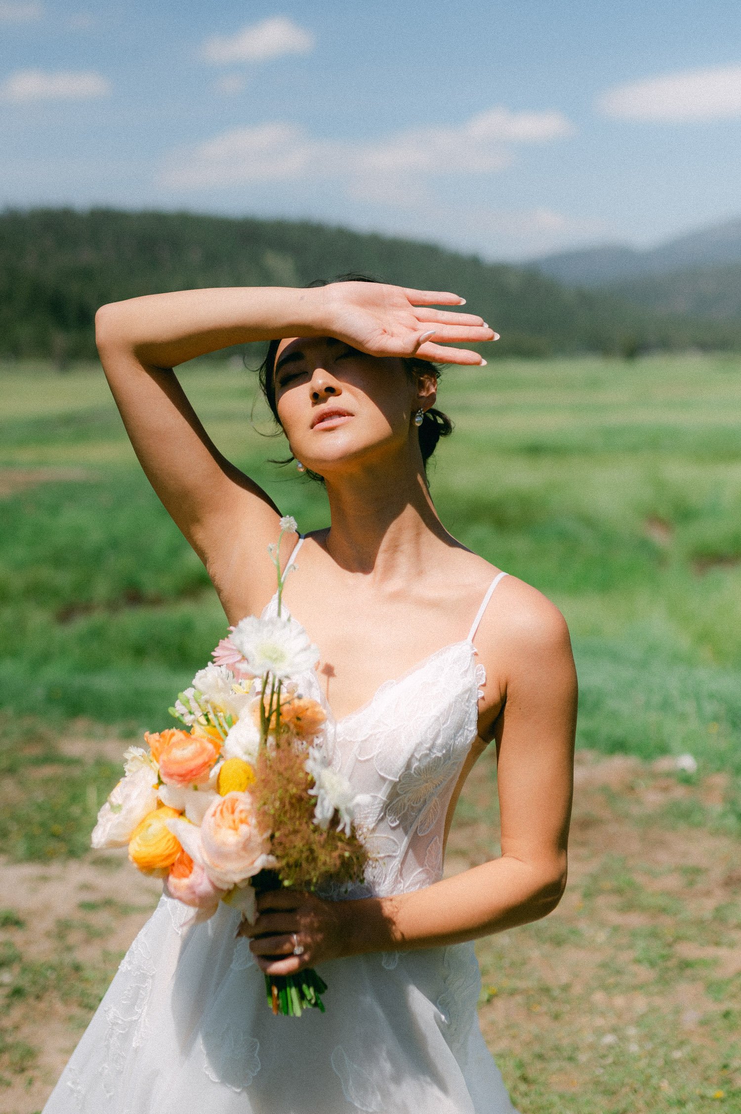olympic valley stables wedding, photo of the bride and her spring flowers