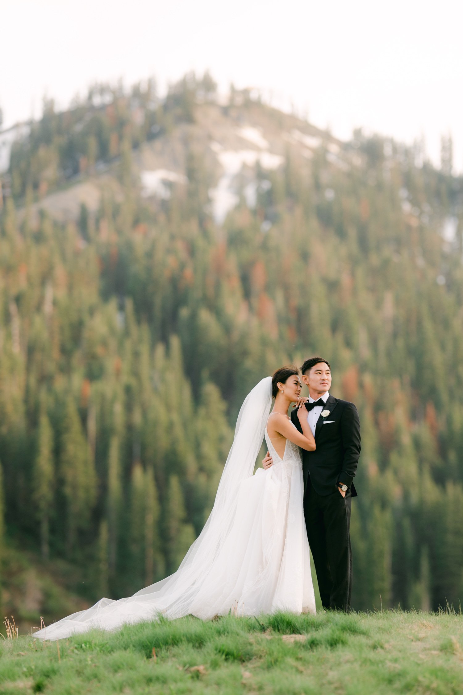 olympic valley stables wedding, photo of the newly wed couple posing by the valley