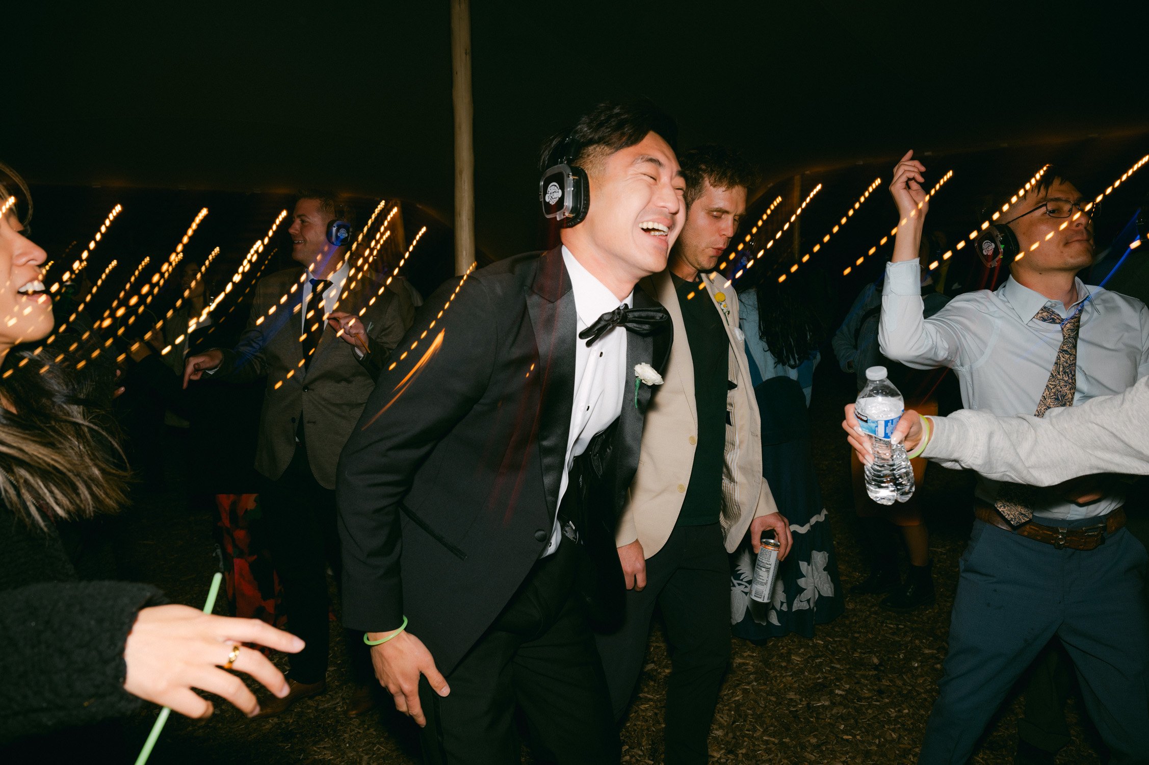 olympic valley stables wedding, photo of the groom and guests enjoying the silent disco