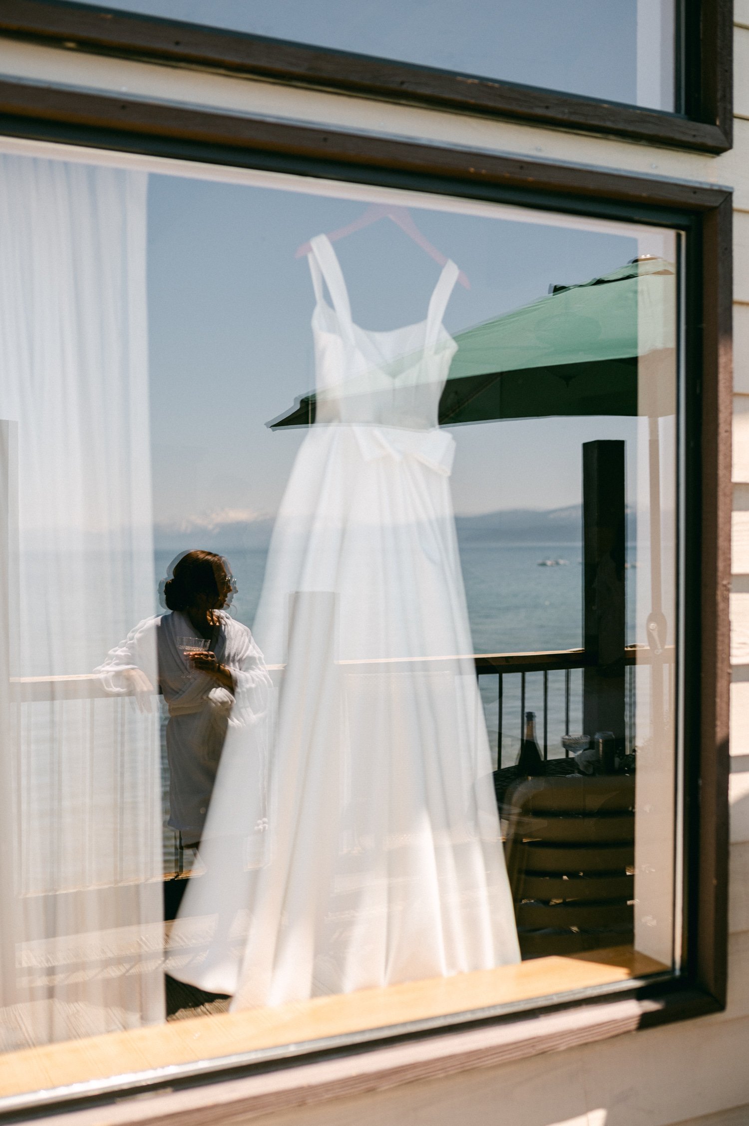 tahoe event center - lake tahoe wedding, photo of the wedding dress by the window