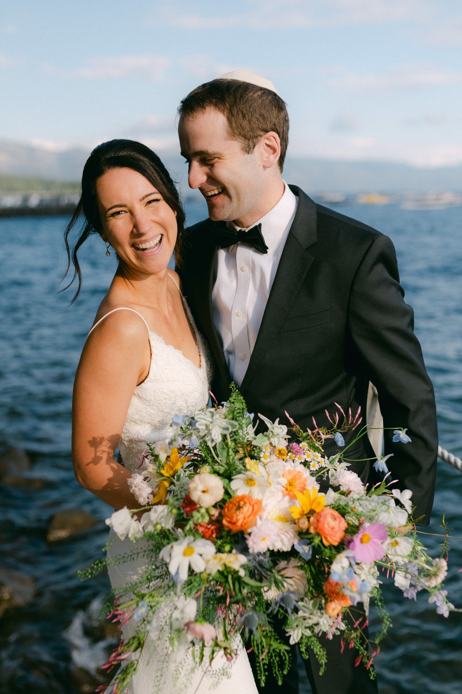 lake tahoe wedding, photo of the newly wed couple smiling by the lake