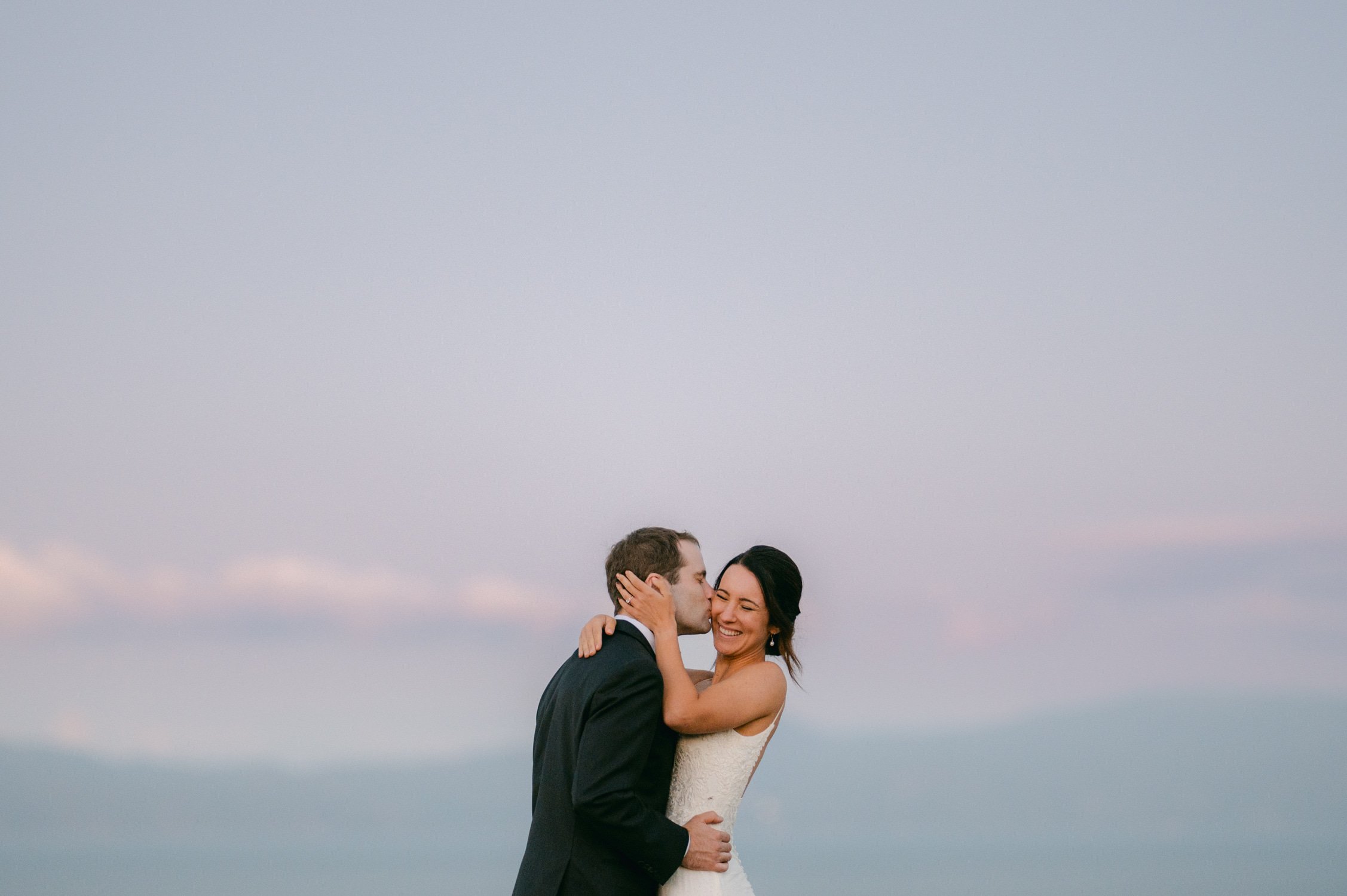 lake tahoe wedding, photo of the groom kissing the bride during their sunset portrait session
