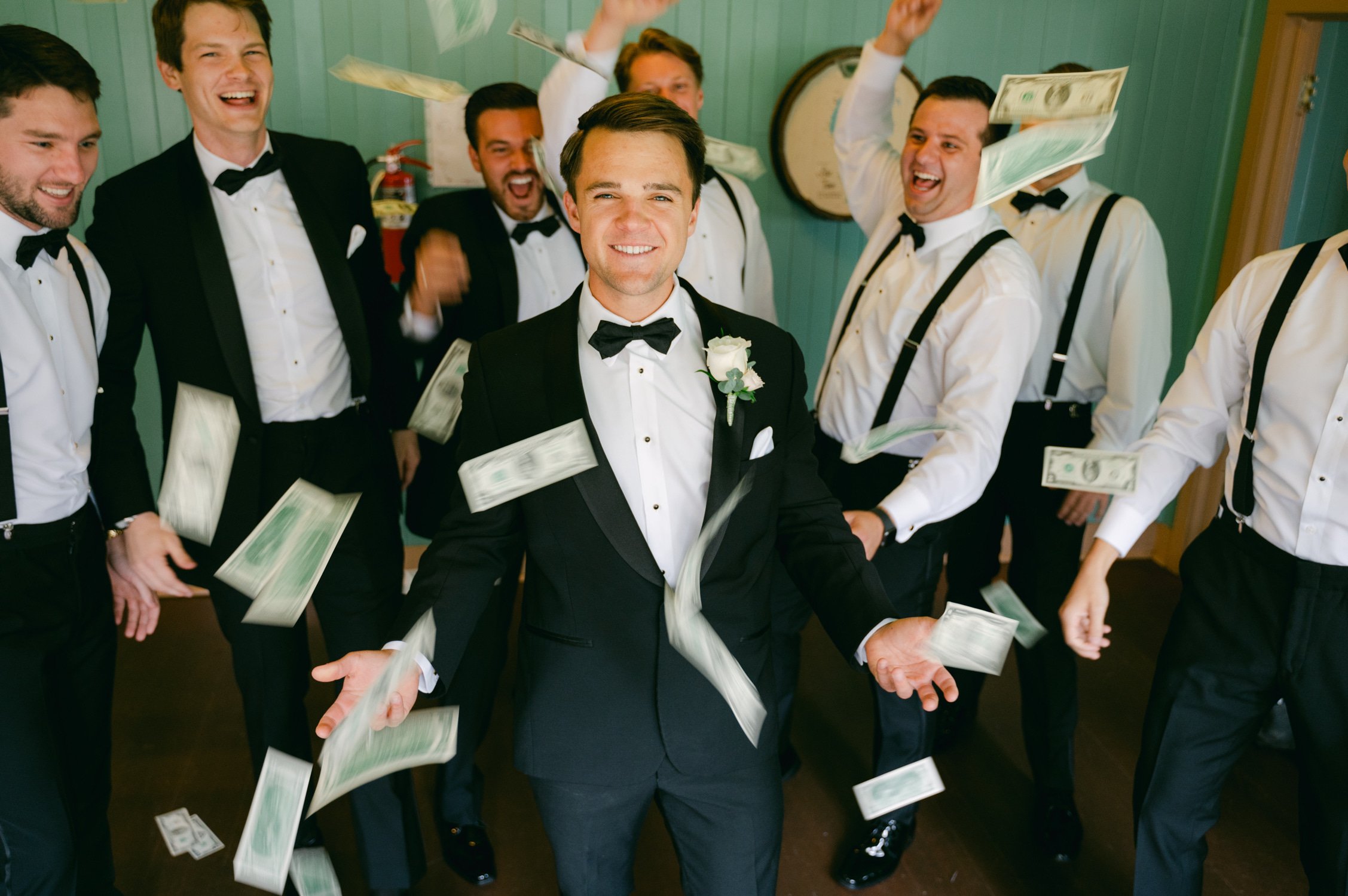 Valhalla Lake Tahoe wedding, photo of groomsmen throwing money to the groom