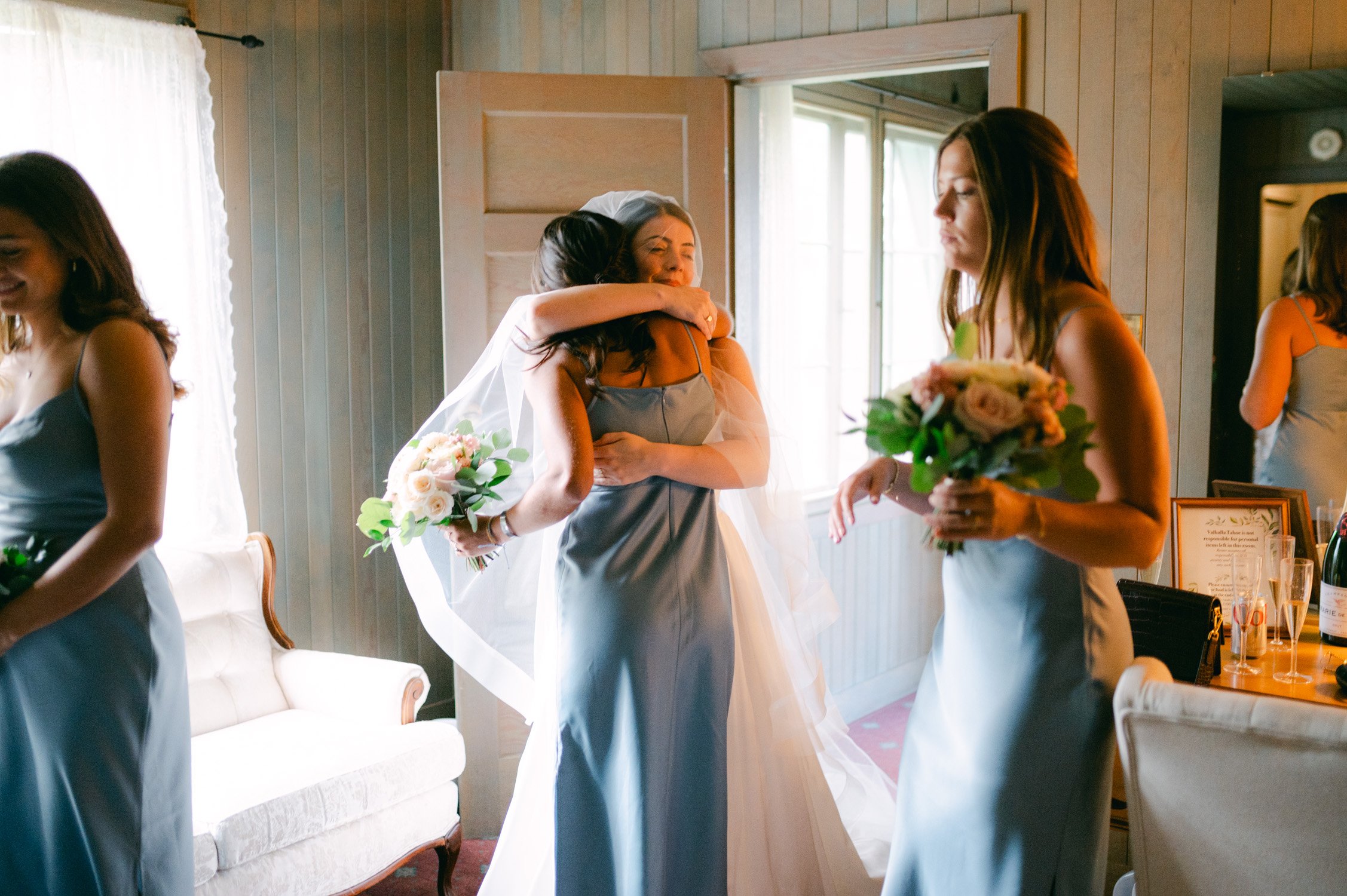 Valhalla Lake Tahoe wedding, photo of the bride embracing her bridesmaids