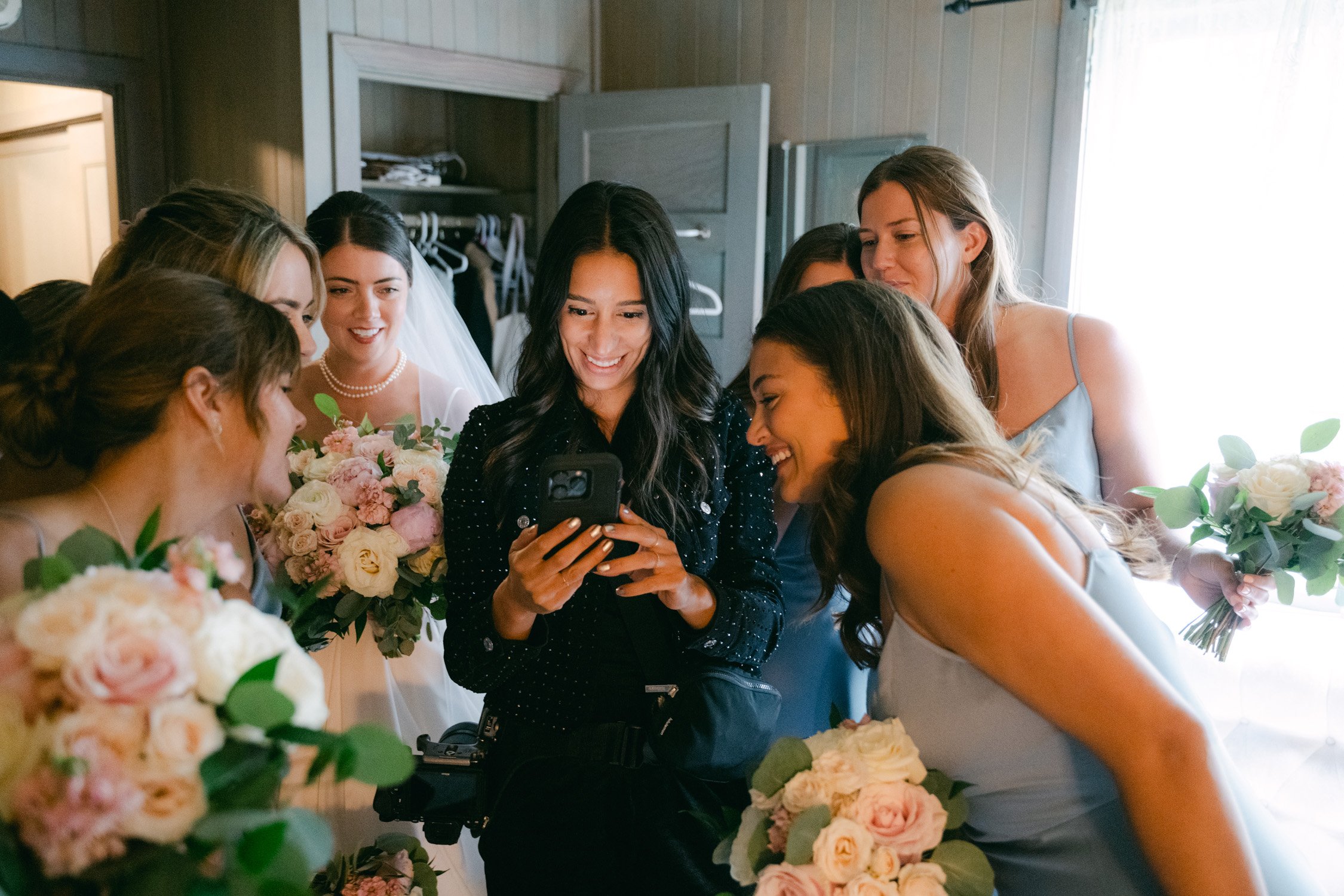 Valhalla Lake Tahoe wedding, photo of the bridal party taking a sneak peek of their photos