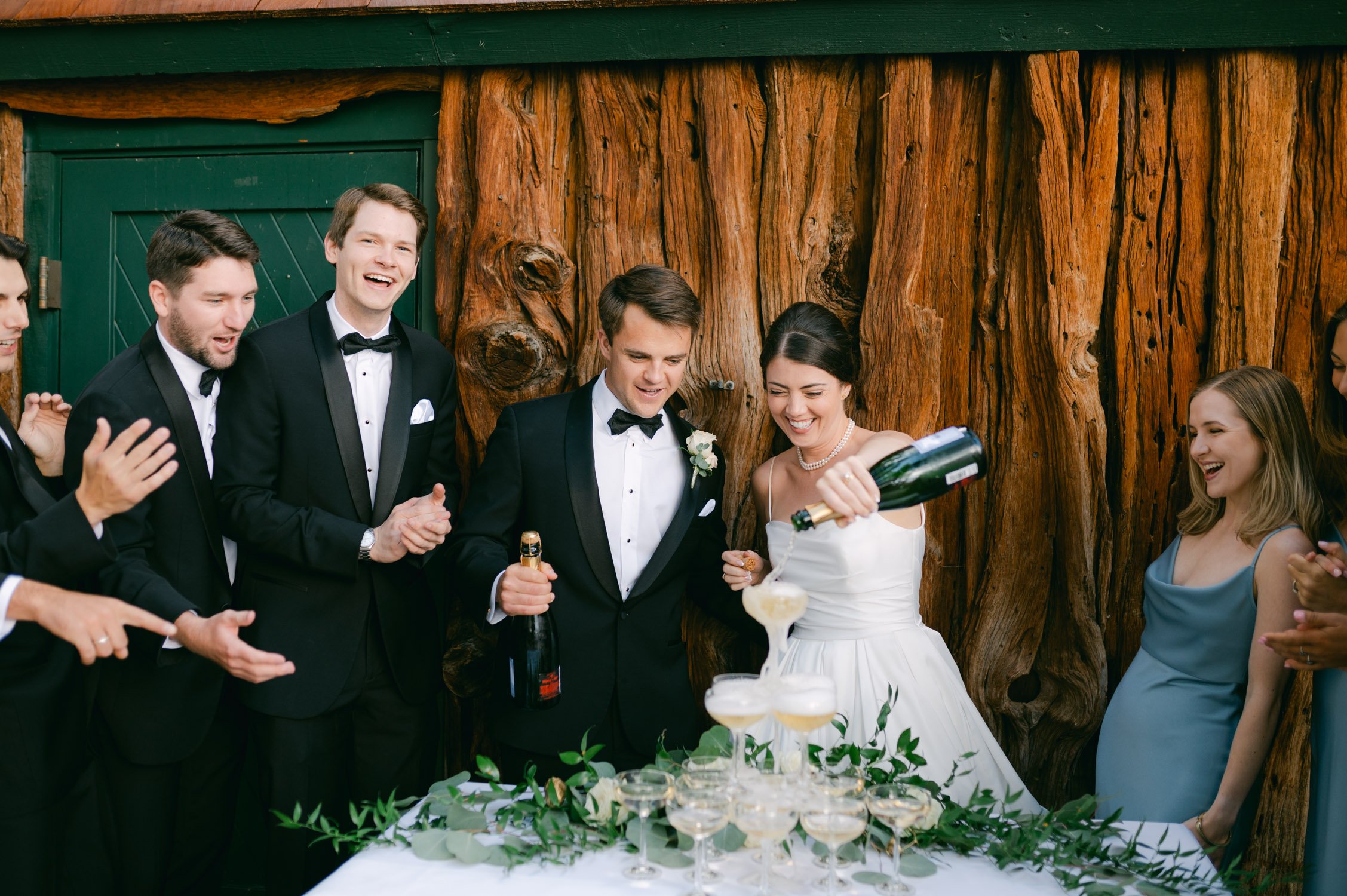 Valhalla Lake Tahoe wedding, photo of the newly wed couple pouring champagne