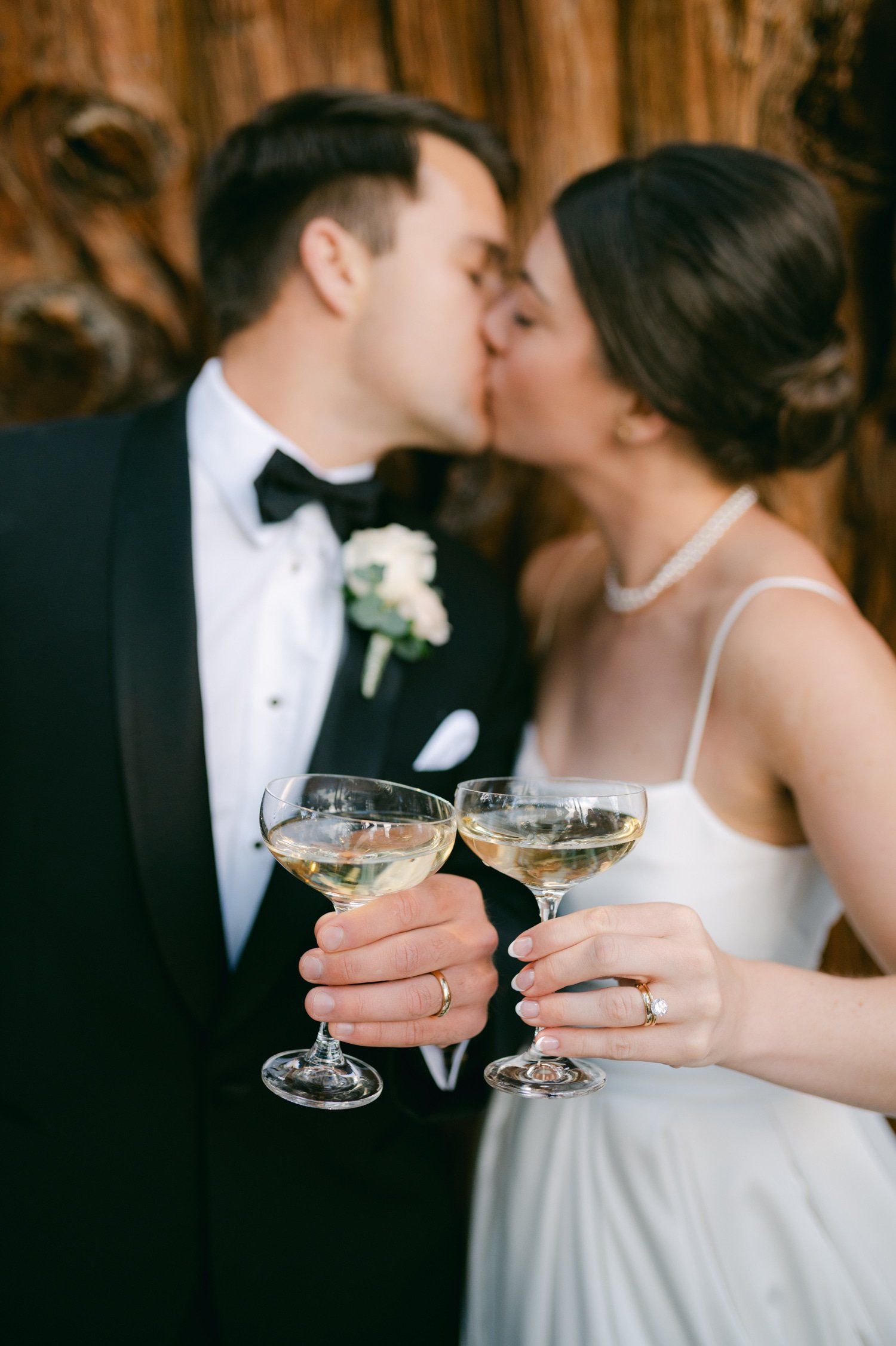 Valhalla Lake Tahoe wedding, photo of the newly wed couple kissing while having a toast