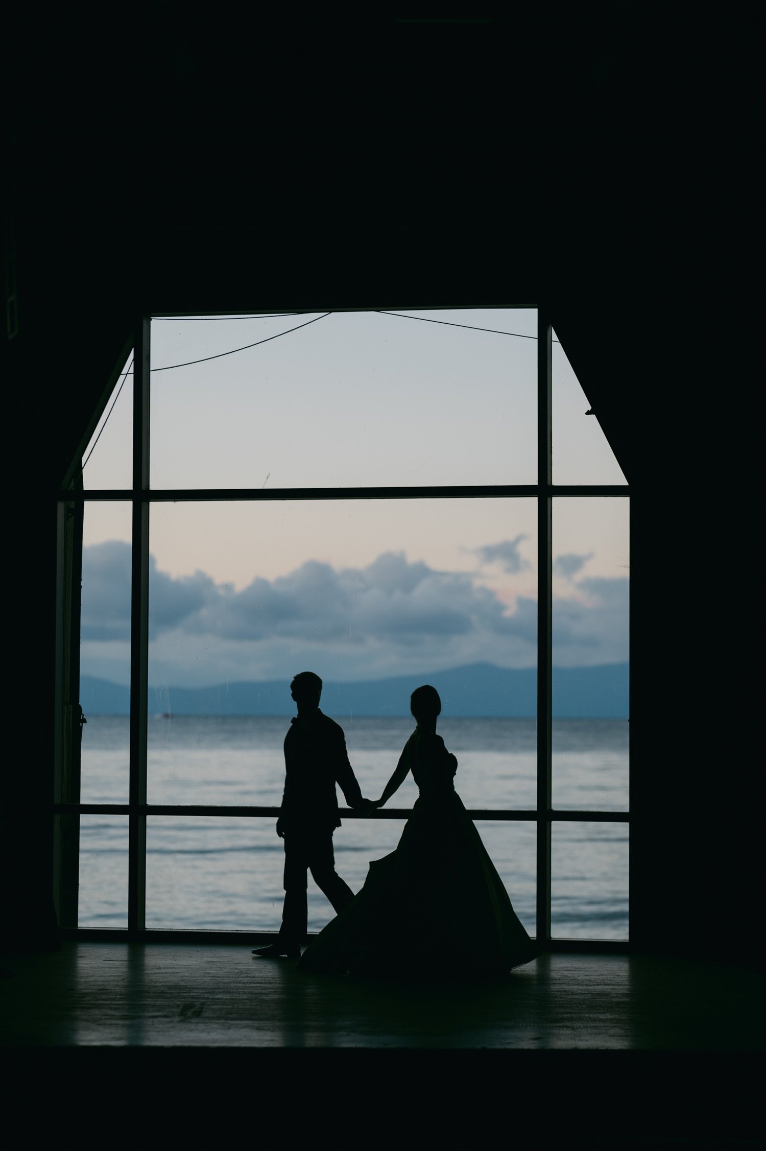 Valhalla Lake Tahoe wedding, silhouette photo of the couple standing by the window