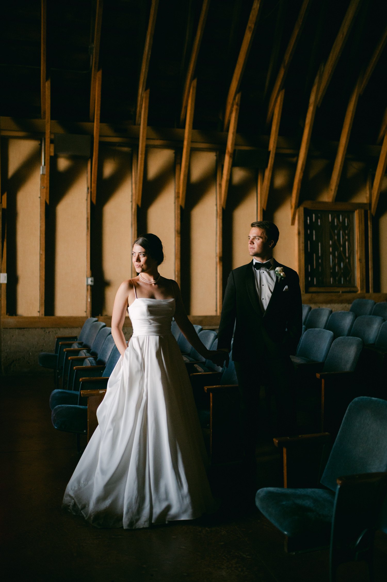 Valhalla Lake Tahoe wedding, photo of the newly wed couple holding hands looking at the side