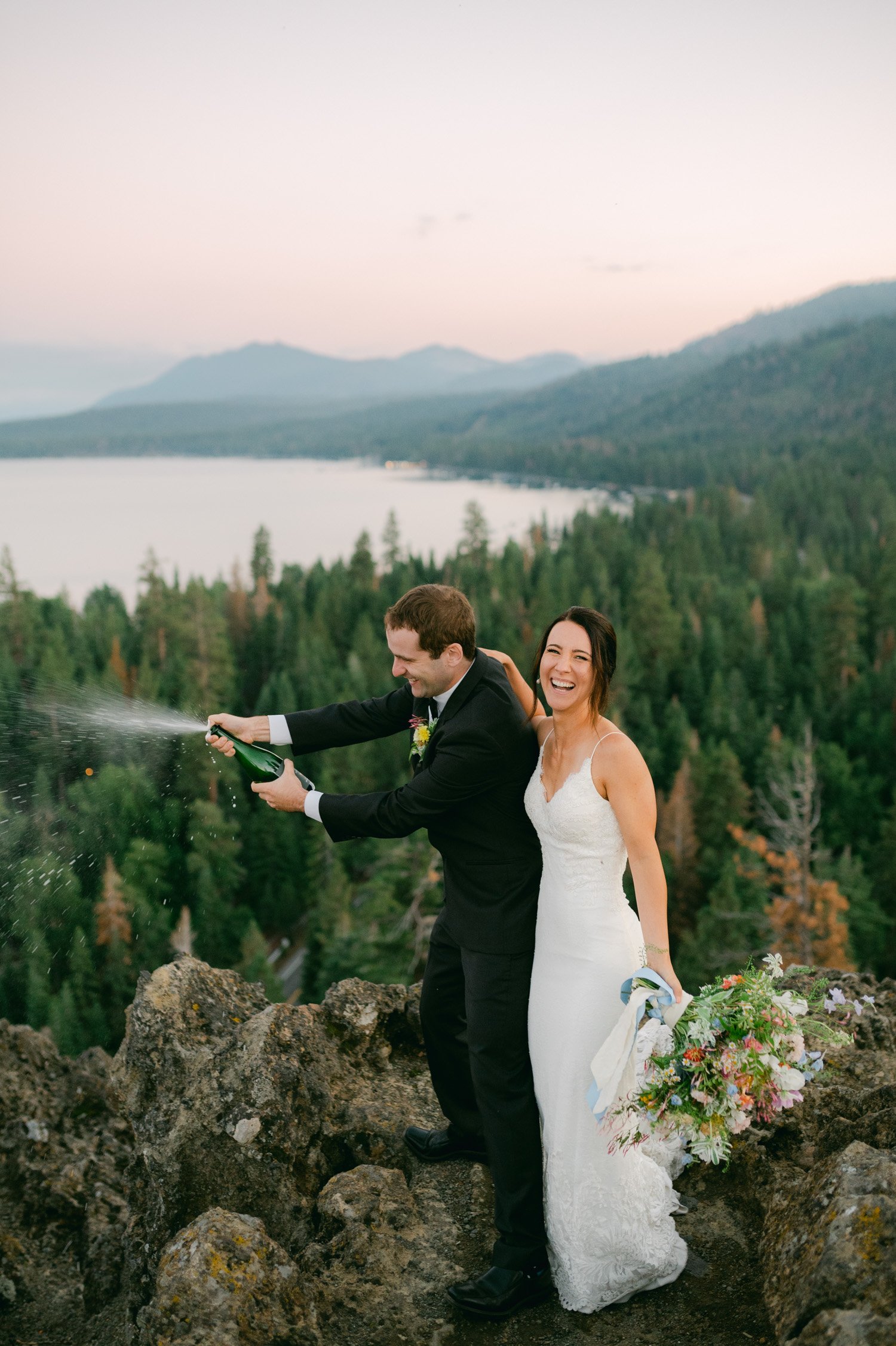 lake tahoe wedding, photo of the newly wed couple doing a champagne spray