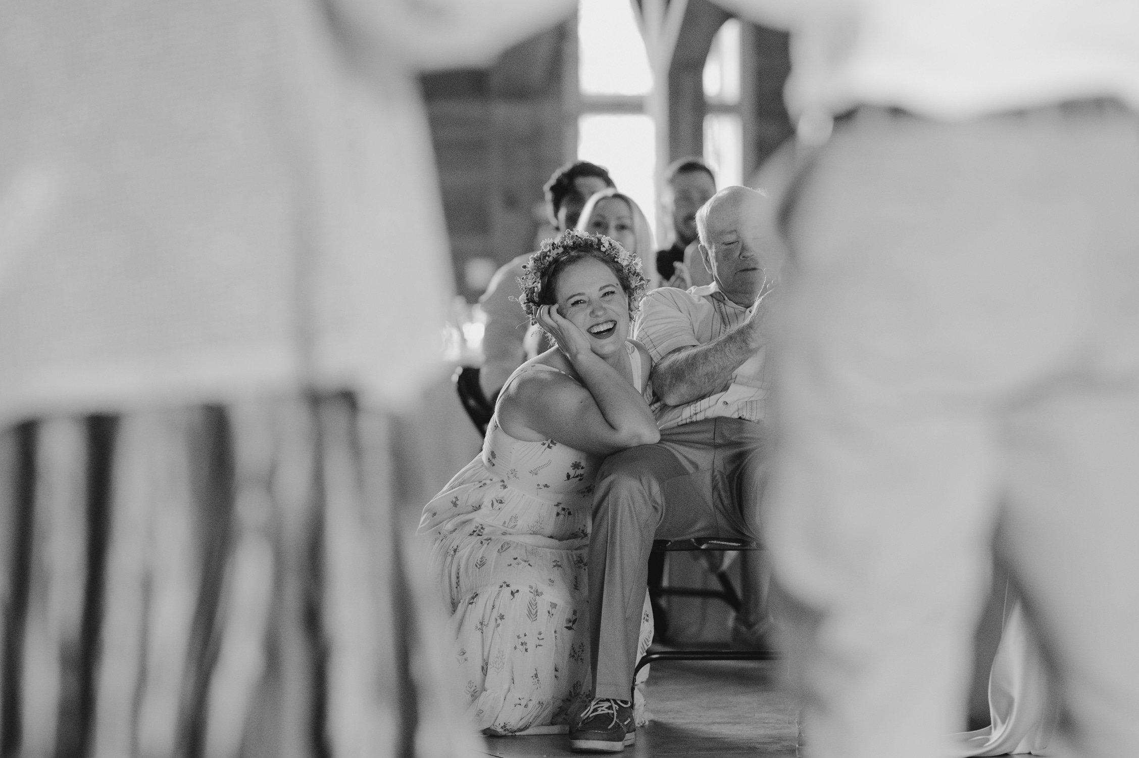 graeagle corner barn wedding, photo of the bride smiling and listening intently during the speeches
