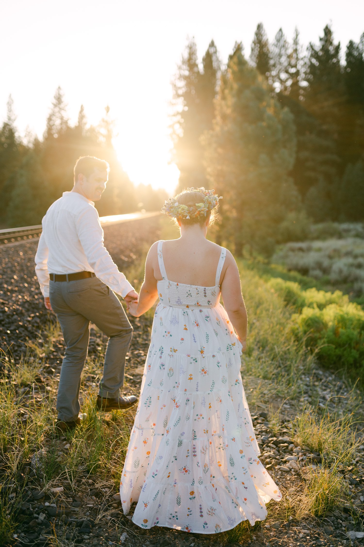 graeagle corner barn wedding, photo of the newlywed couple walking away during their sunset portraits