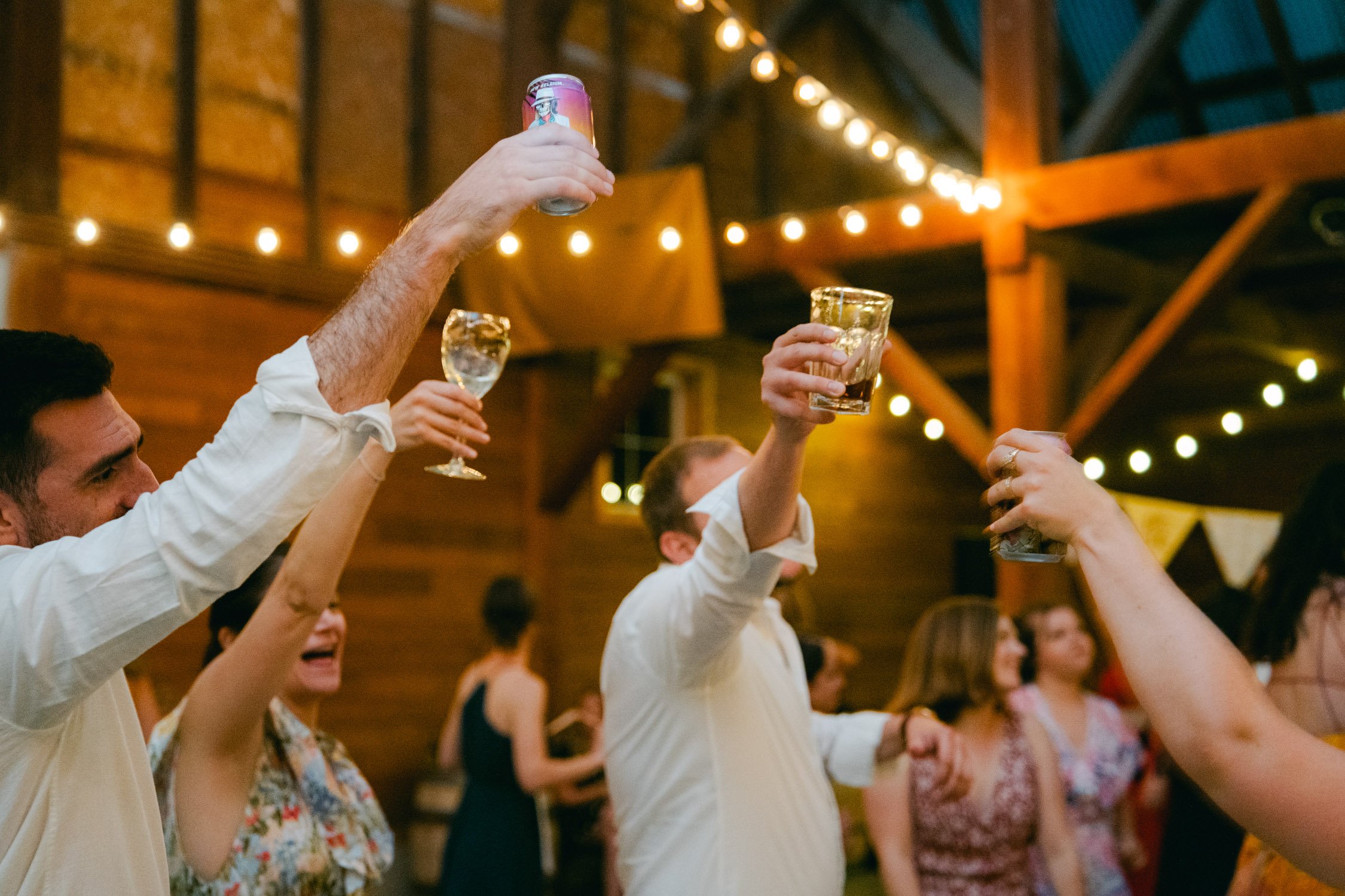 graeagle corner barn wedding, photo of the guests doing a toasts during the evening reception