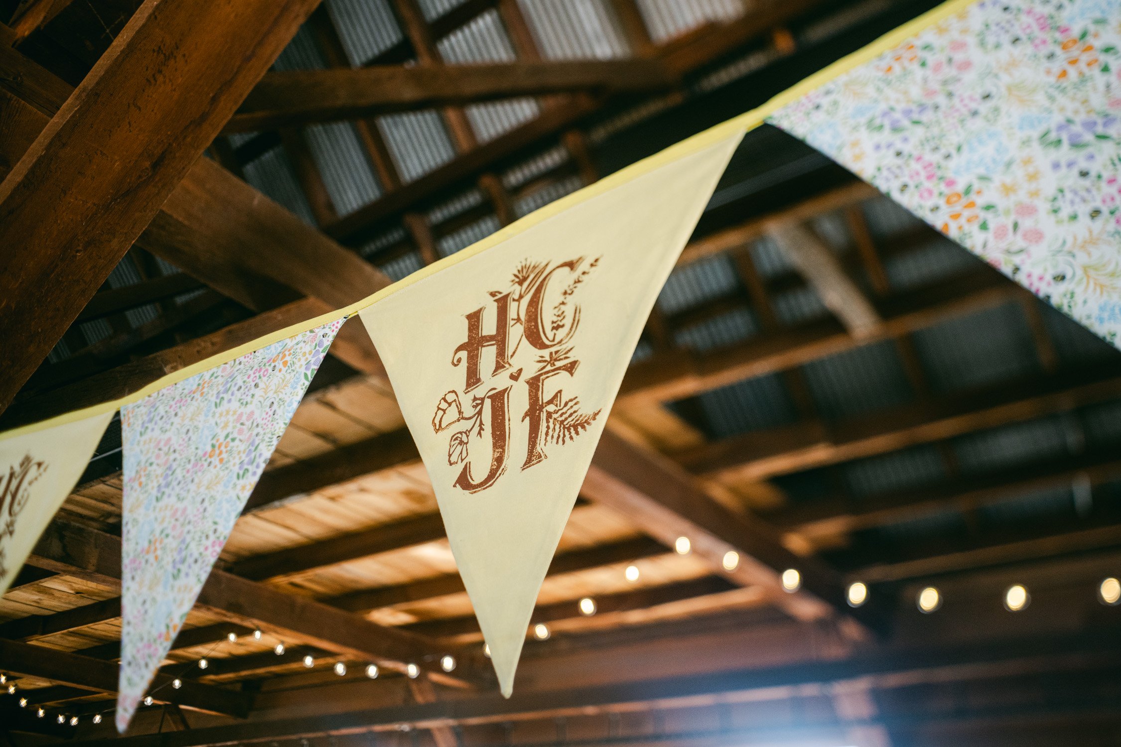 graeagle corner barn wedding, photo of the wedding banner with the couple's initials