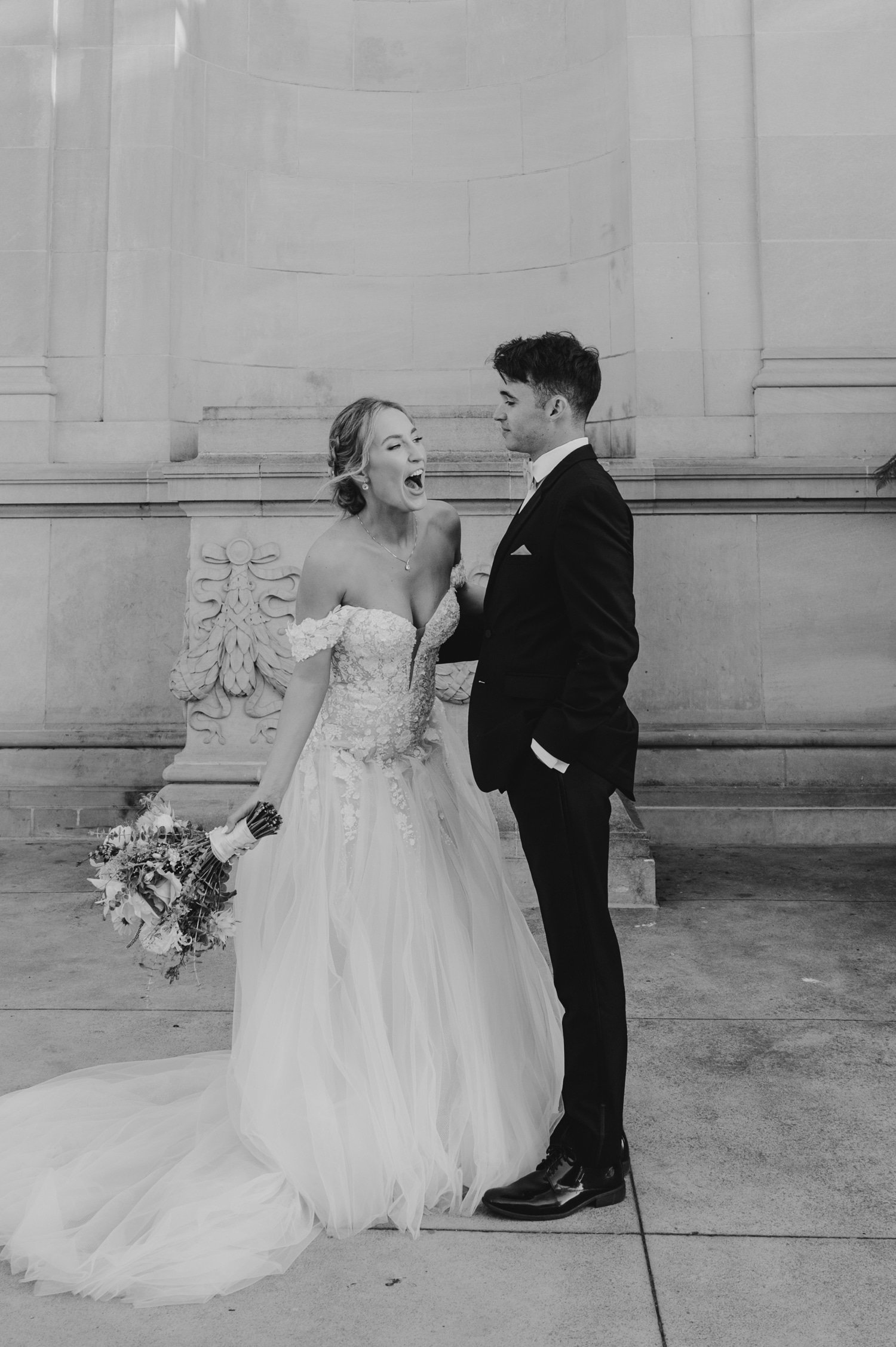 California academy of Sciences in San Francisco Wedding, photo of the couple in black and white with the bride being so happy