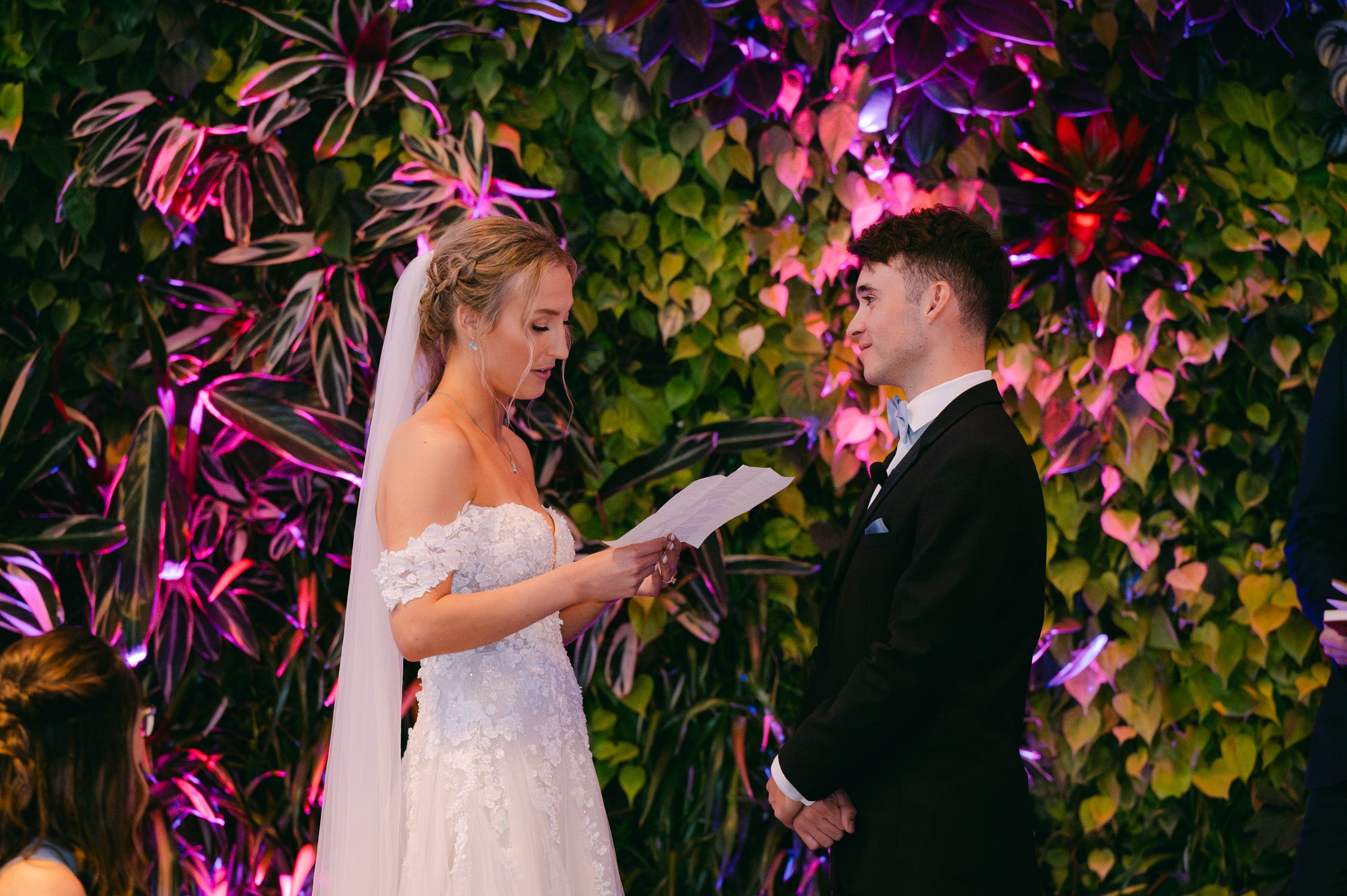 California academy of Sciences in San Francisco Wedding, photo of the bride giving her speech in front of the groom
