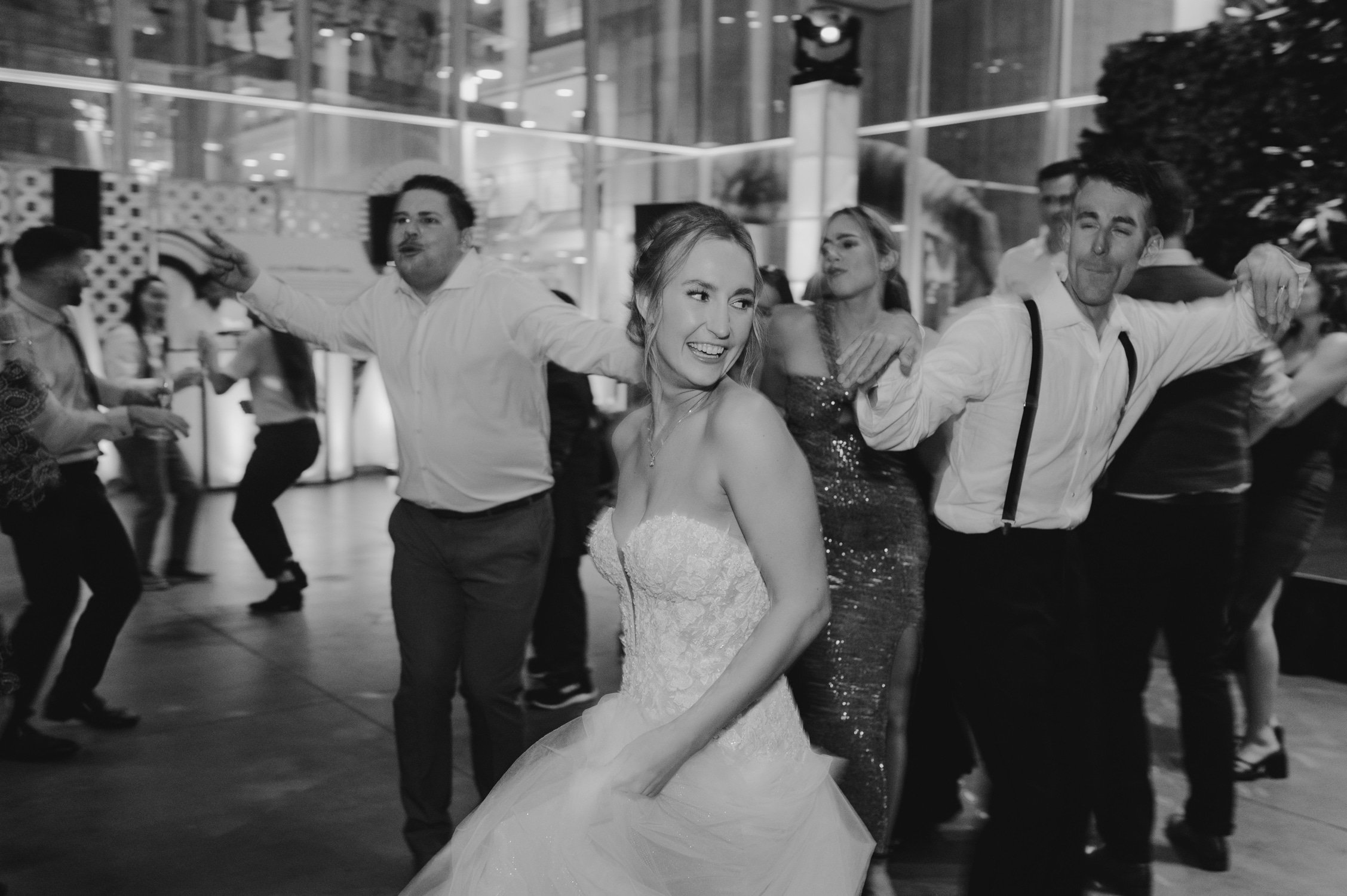 California academy of Sciences in San Francisco Wedding, photo of the bride dancing with the wedding guests