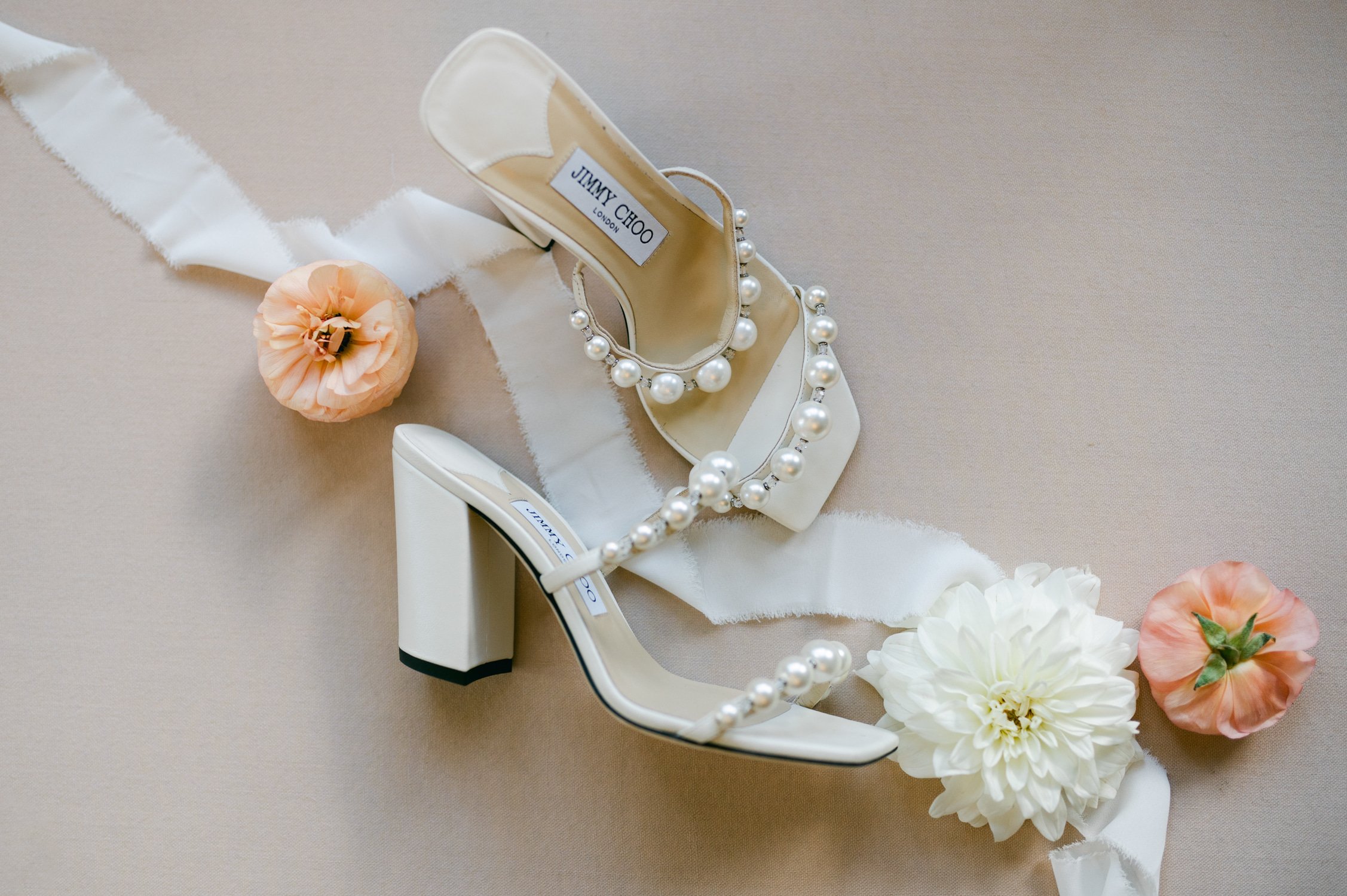 Martis Camp Wedding, photo of the bride’s Jimmy Choo's wedding shoes with pearl accents