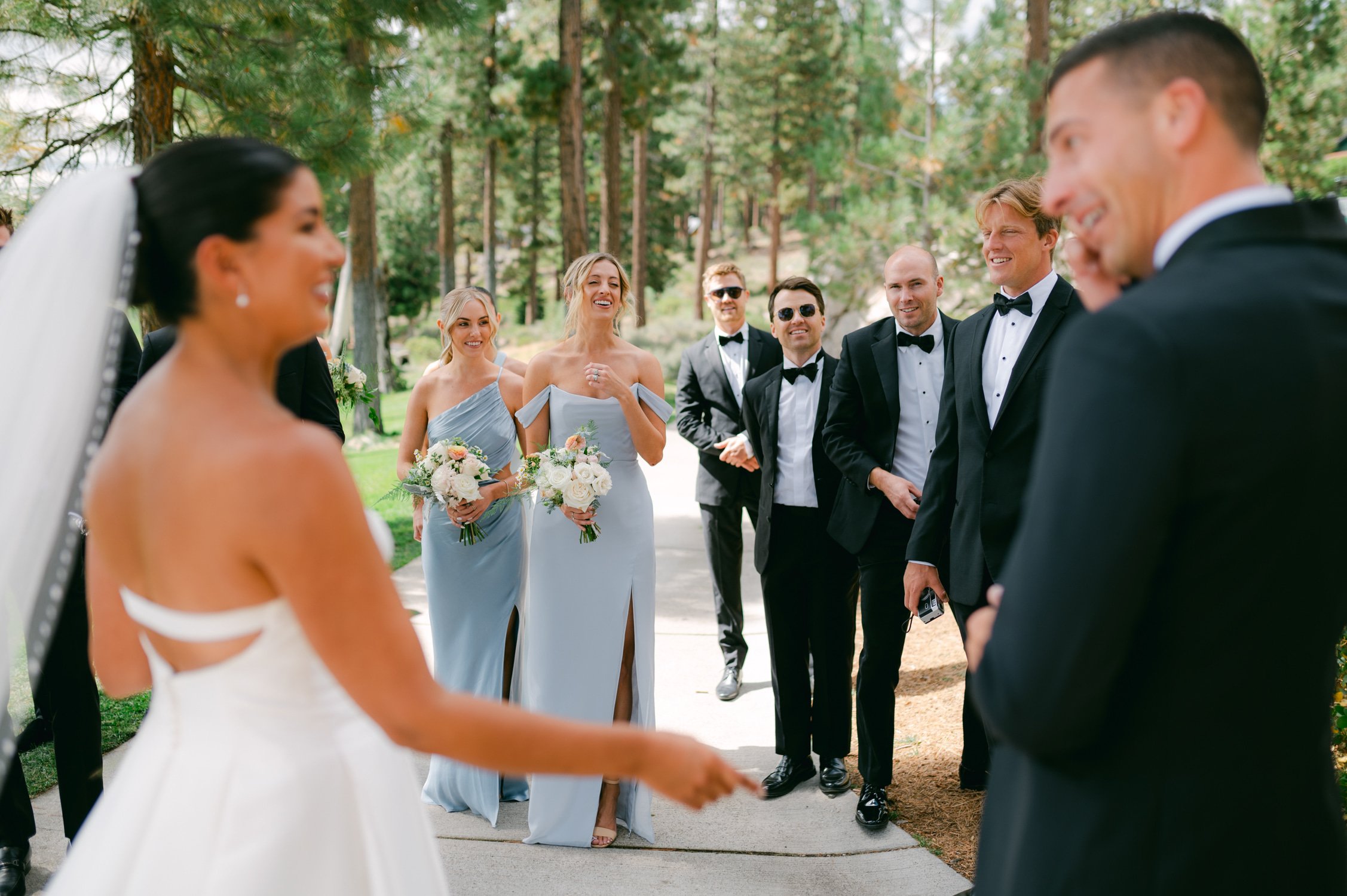 Martis Camp Wedding, photo of the couple walking towards their wedding party