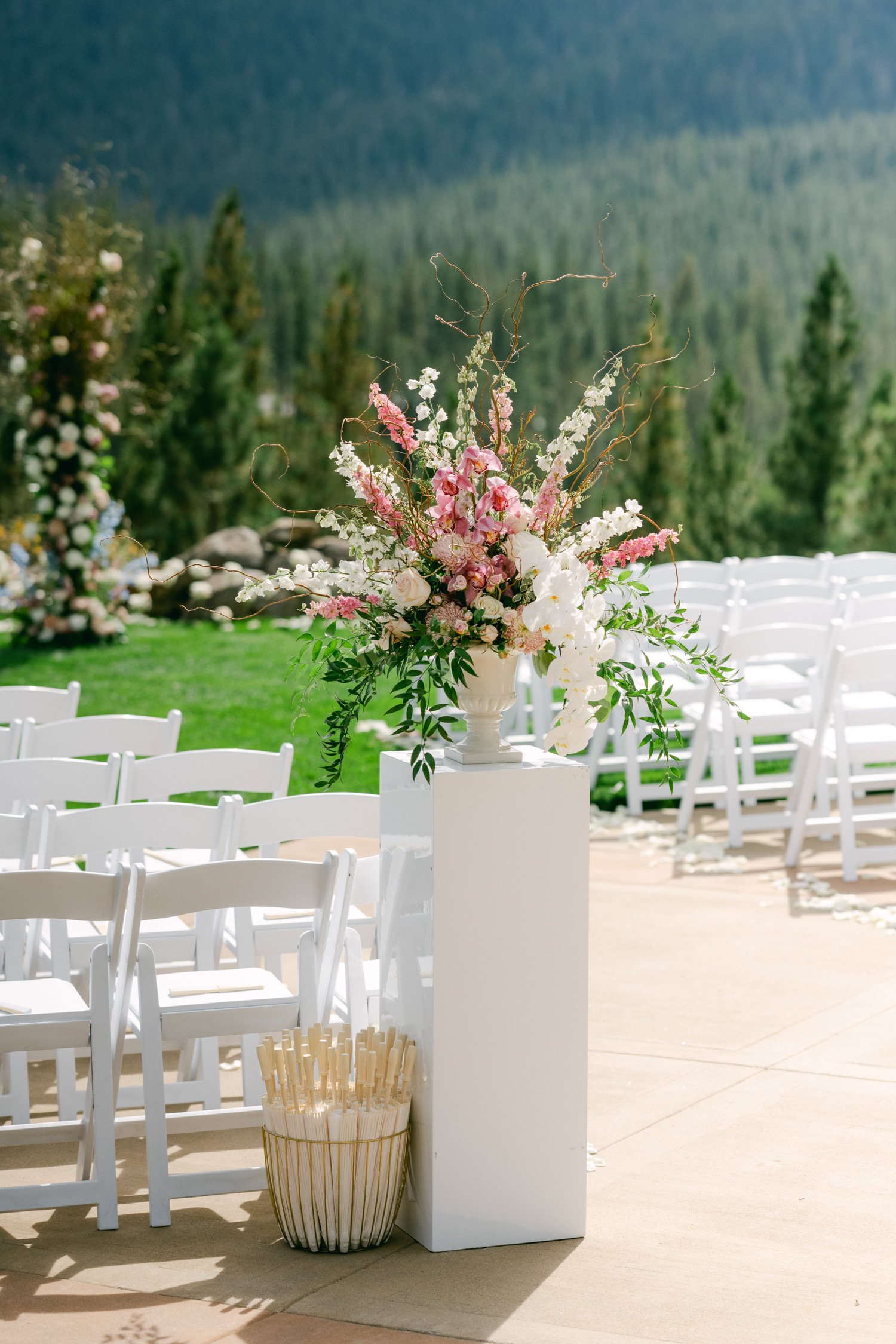 Martis Camp Wedding, photo of pink flower decor for outdoor wedding