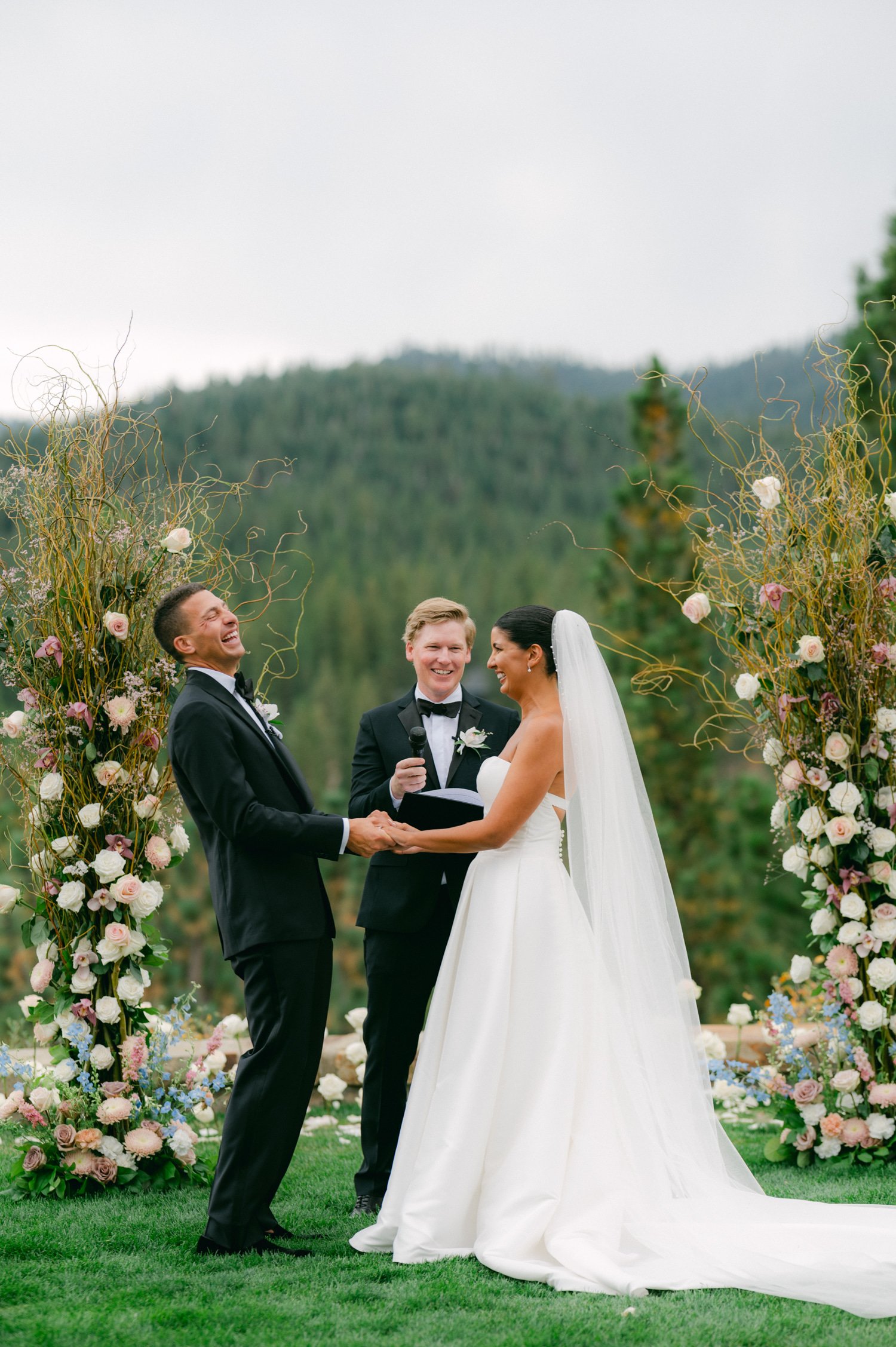 Martis Camp Wedding, photo of the couple laughing during the ceremony