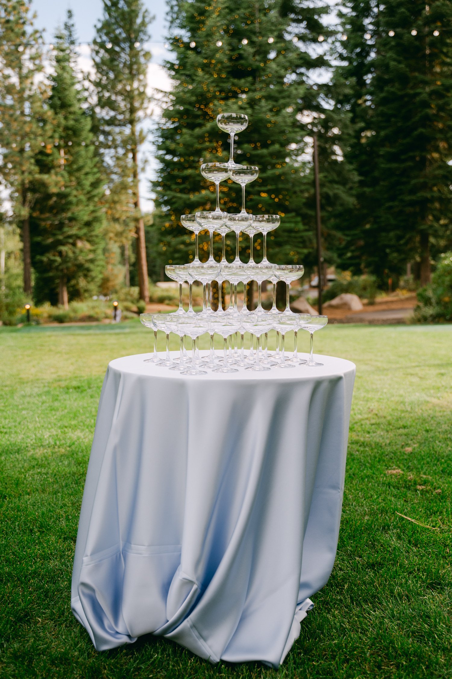 Martis Camp Wedding, photo of the champagne glass tower on a blue cloth