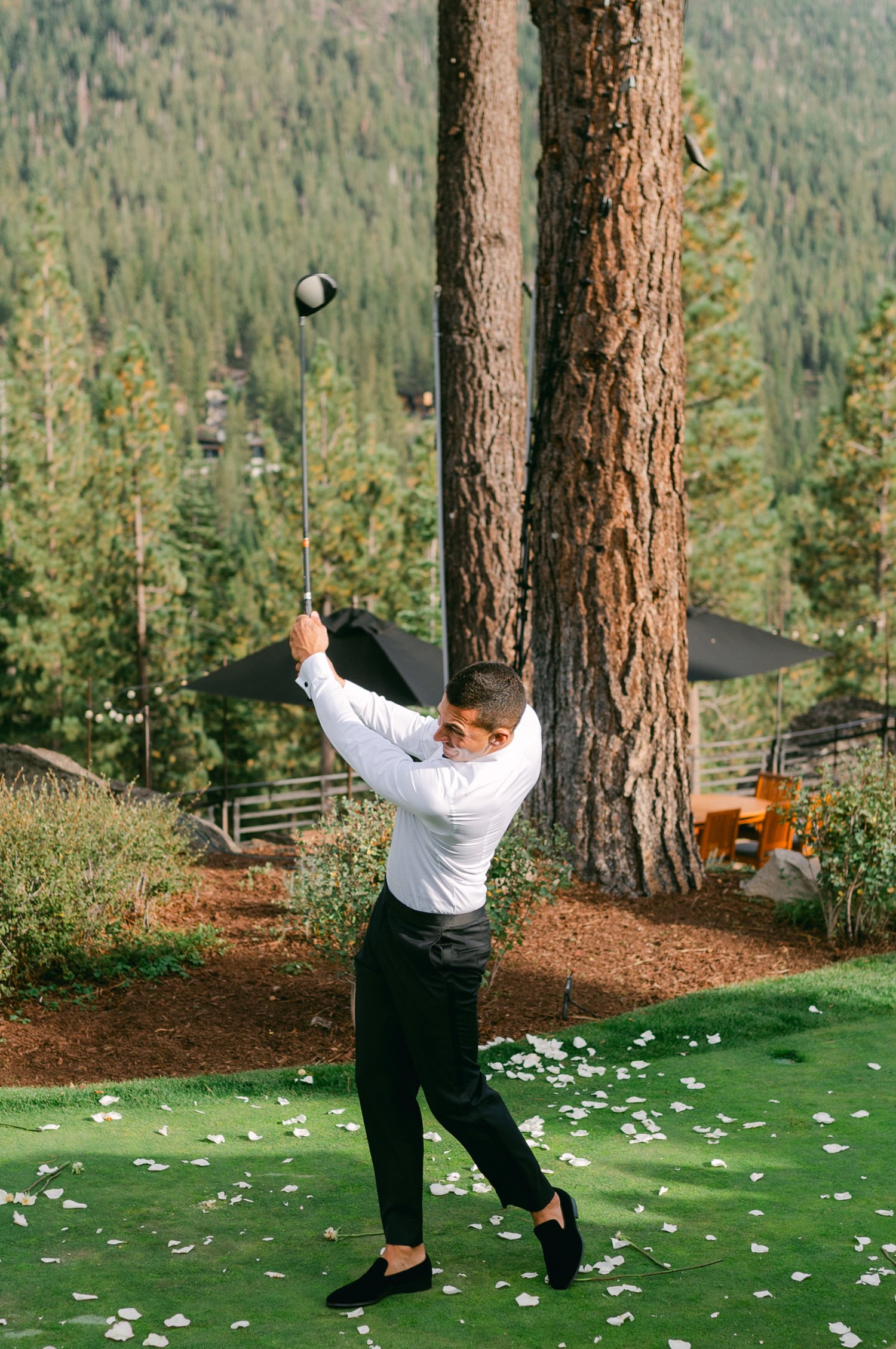 Martis Camp Wedding, photo of the groom playing golf during the afternoon reception