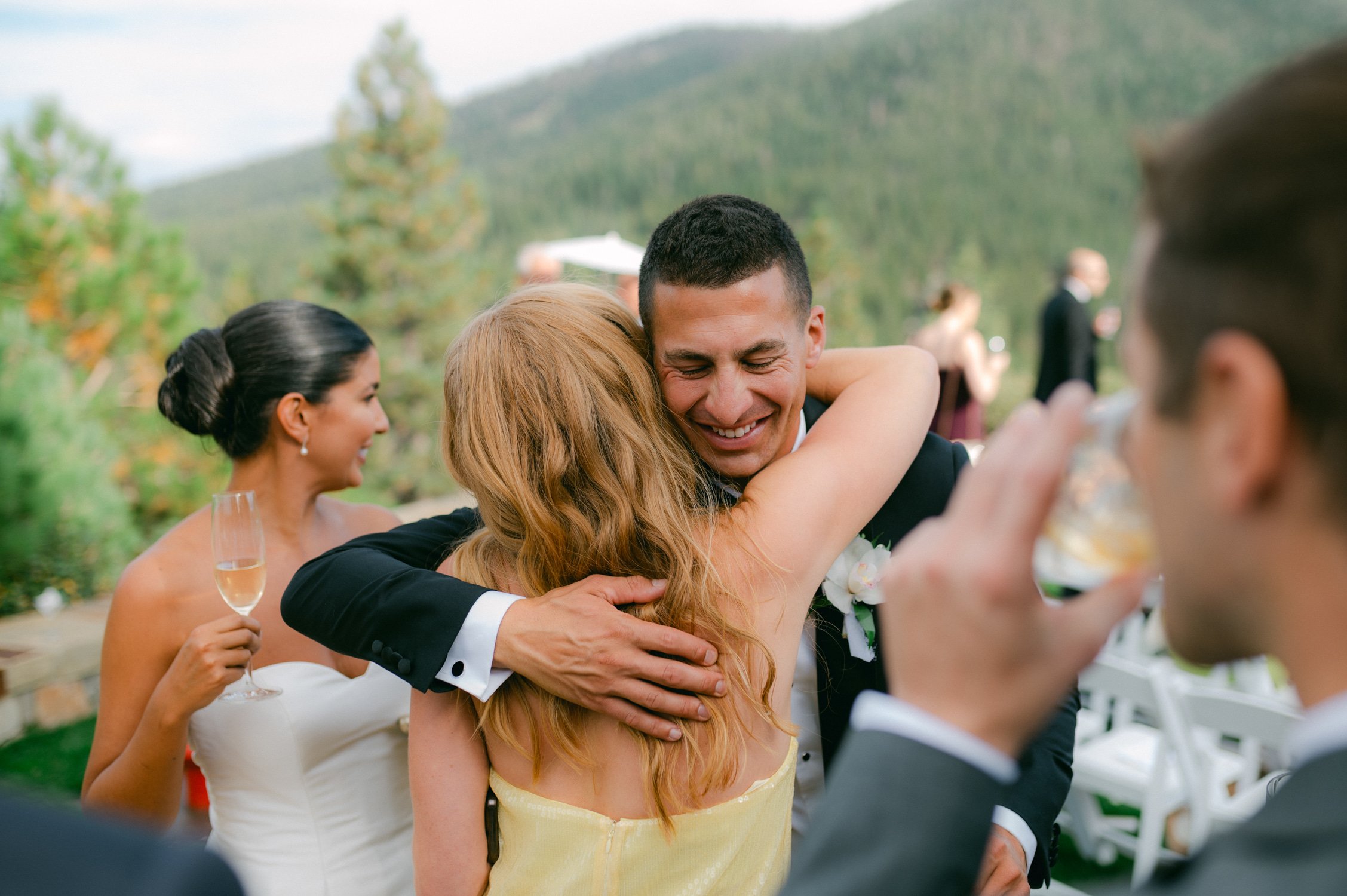 Martis Camp Wedding, photo of the groom hugging the wedding guests